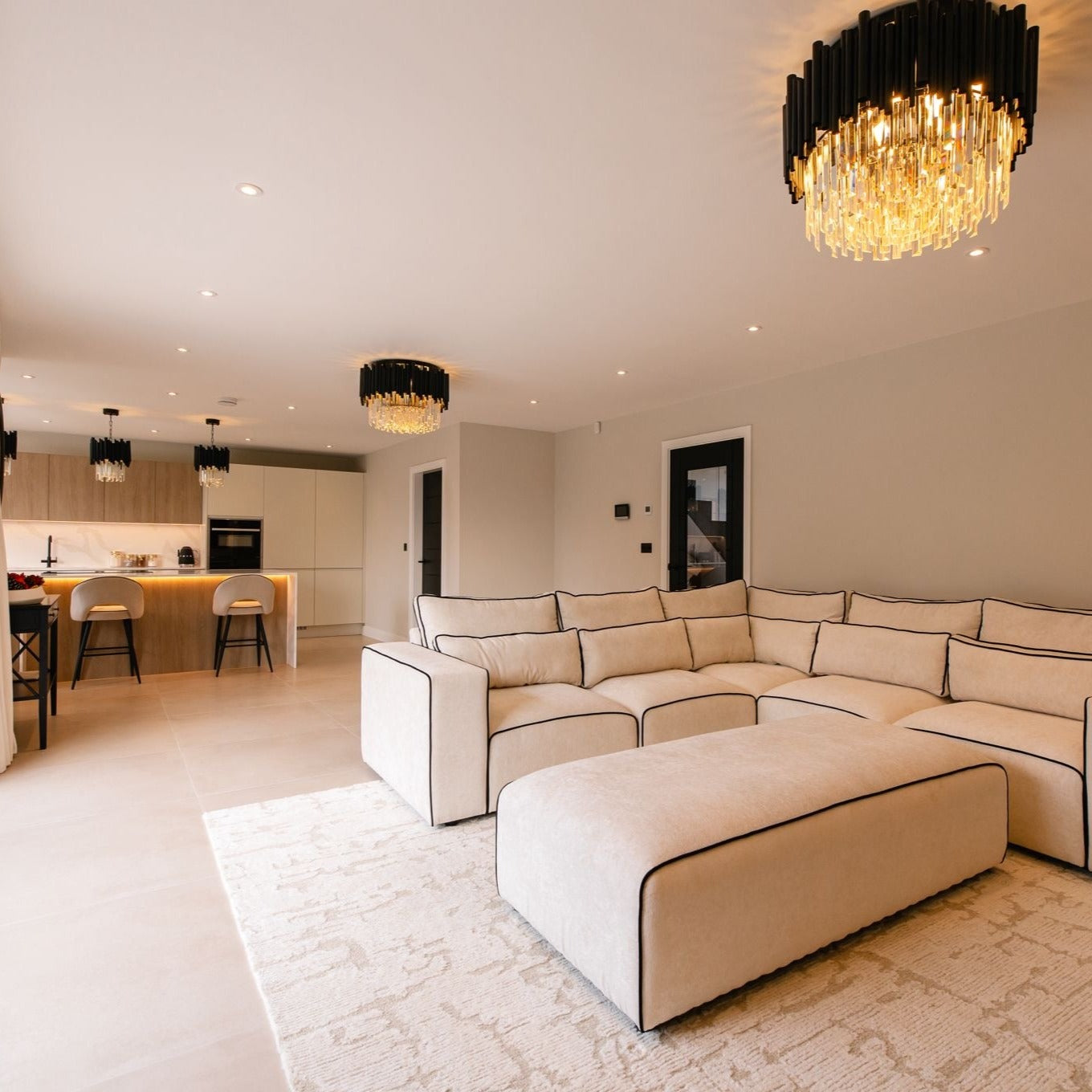 Statement Gotham ceiling light creating a focal point in a contemporary living room.