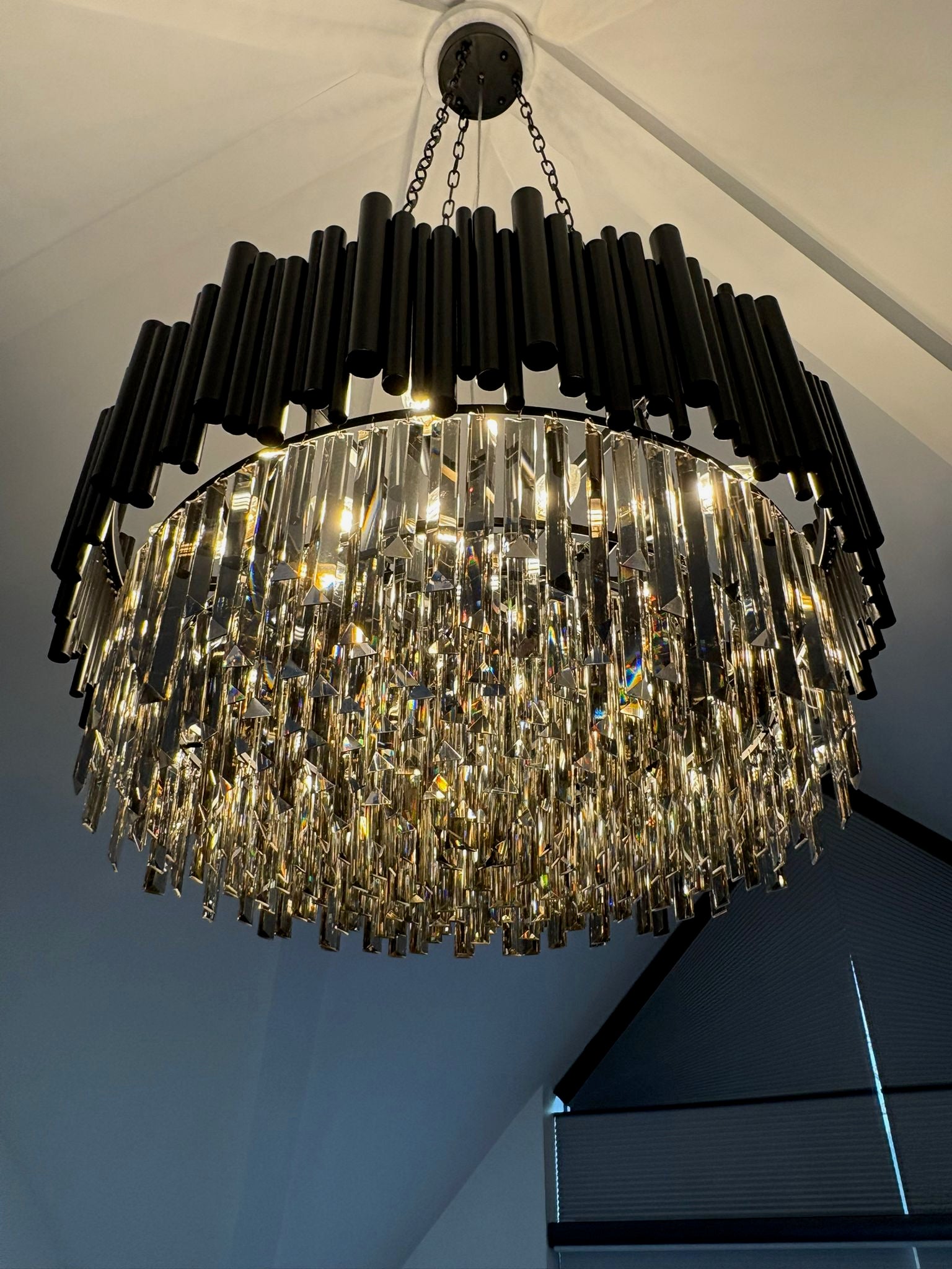 Gotham Circular Chandelier by VORELLI® shown in a tall ceiling installation.
