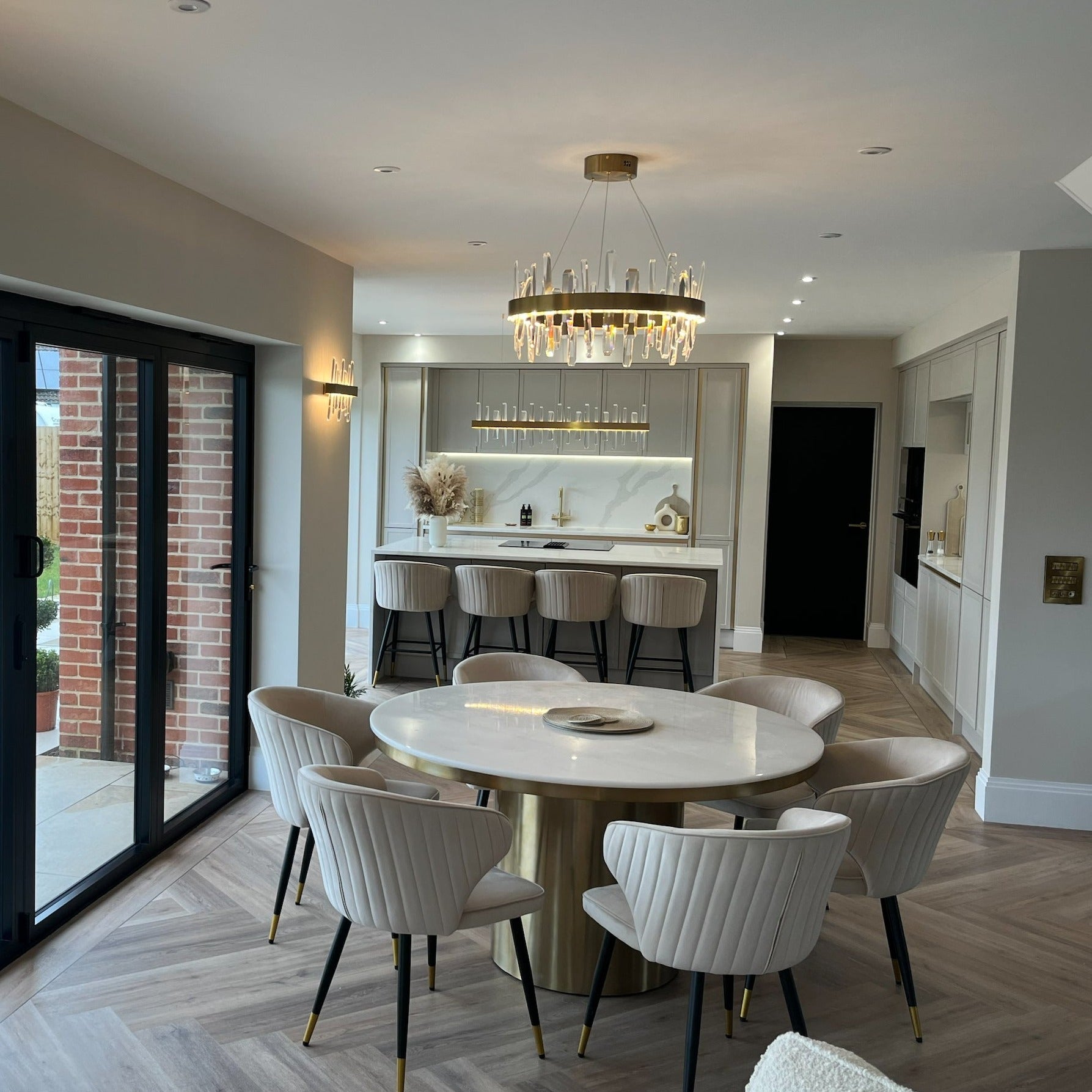 Grantchester Circular Chandelier creating a refined centrepiece in a luxury dining room
