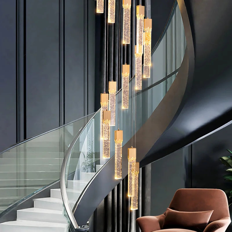 Halstead Pendant Staircase Chandelier installed in a luxury interior creating a dramatic vertical lighting feature