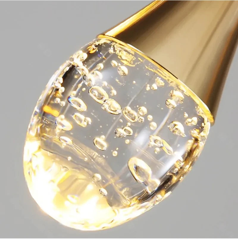 Close-up of illuminated bubble glass detail on the Henley Pendant Staircase Chandelier