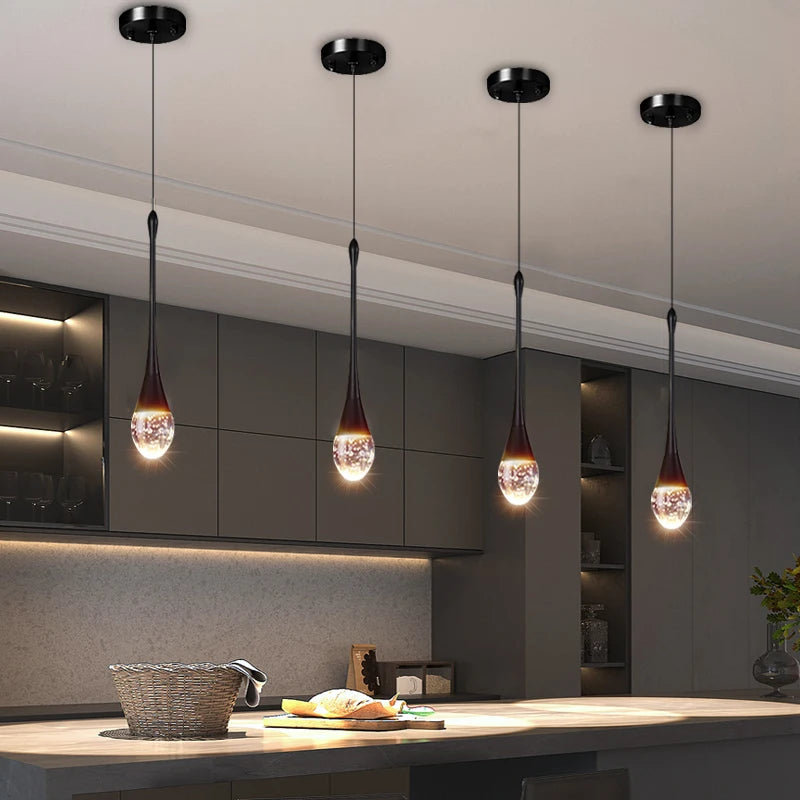 Henley Pendant featuring illuminated bubble glass suspended above a modern kitchen island