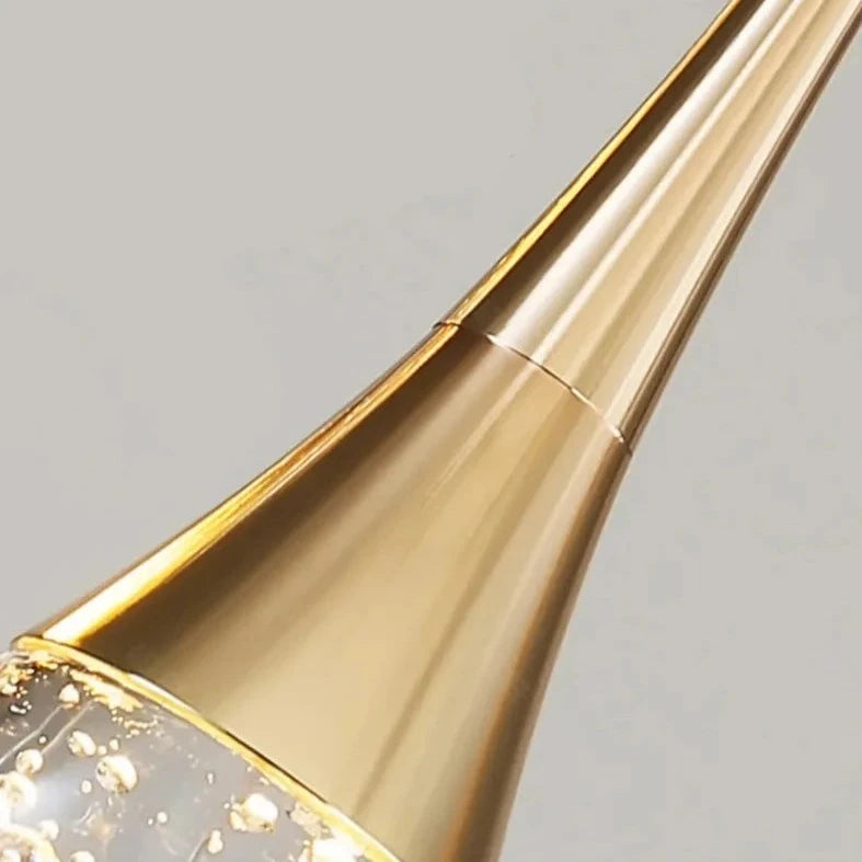 Sleek tapered metal structure of the Henley Pendant with glowing bubble glass tip