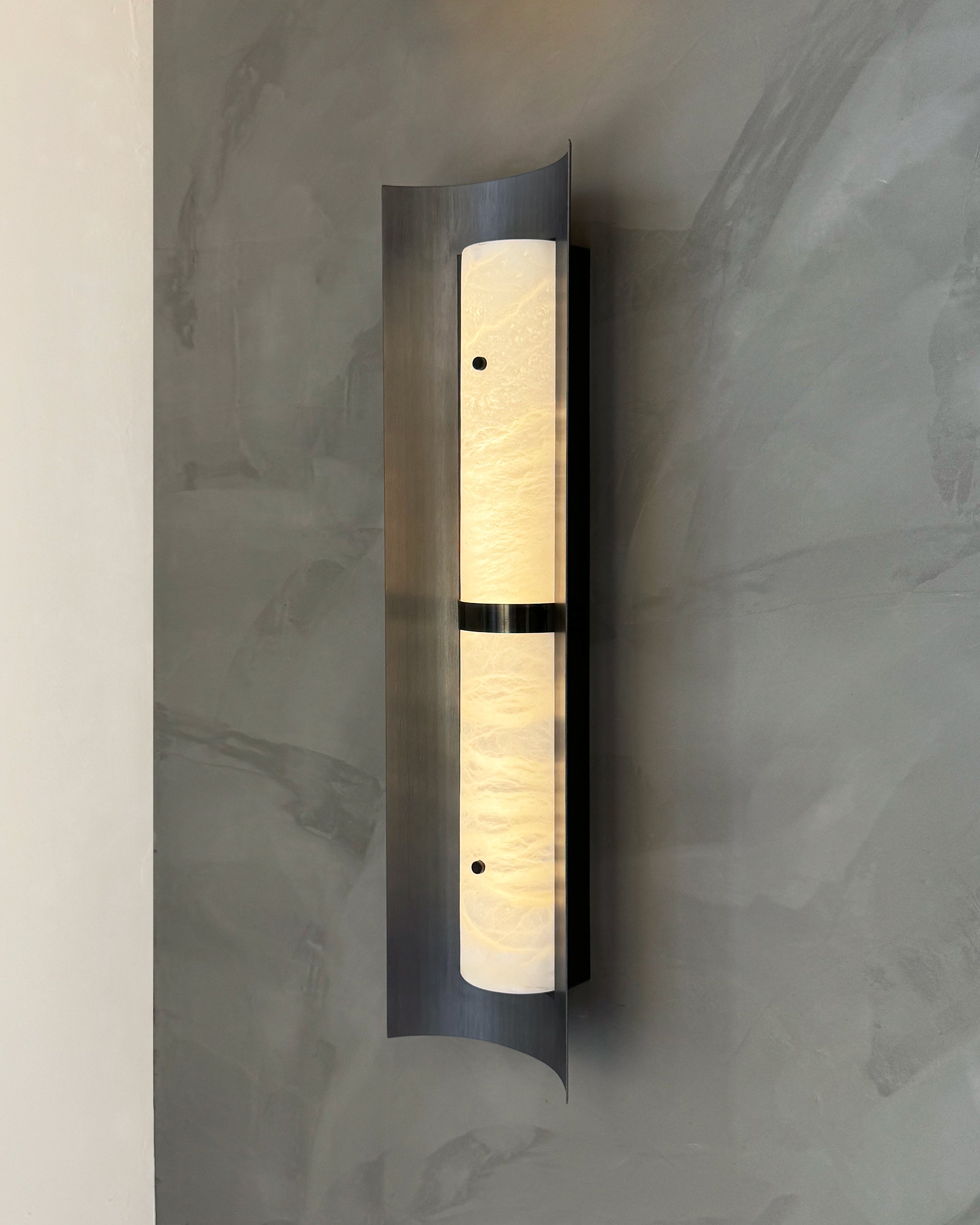 Hercules Marble Wall Light shown in a refined contemporary interior wall lighting setting