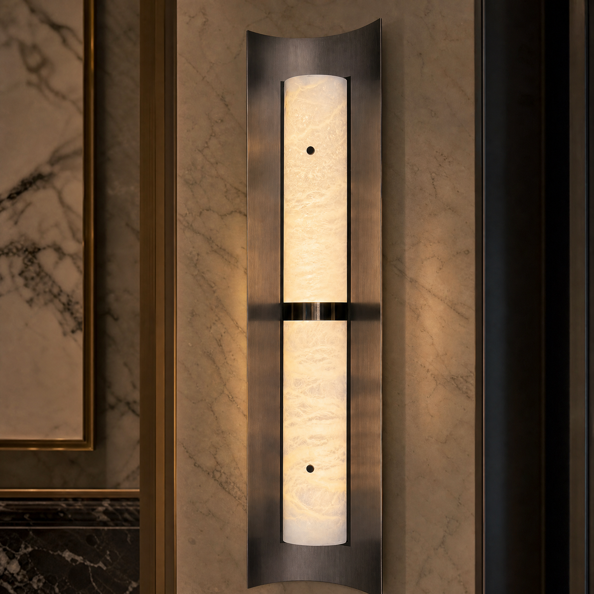 Detailed closeup of the natural marble texture and brushed steel finish of the Hercules wall light