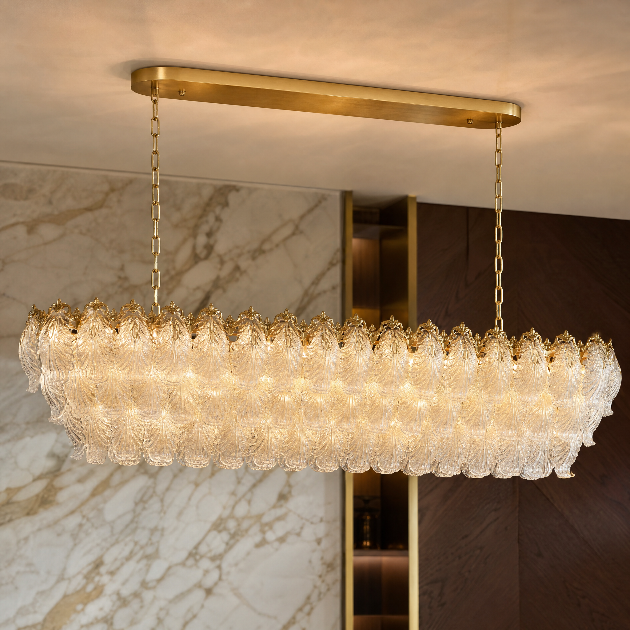 Close-up detail of the classical charm and intricate textured feather-shaped crystals on the VORELLI Julio rectangular chandelier.