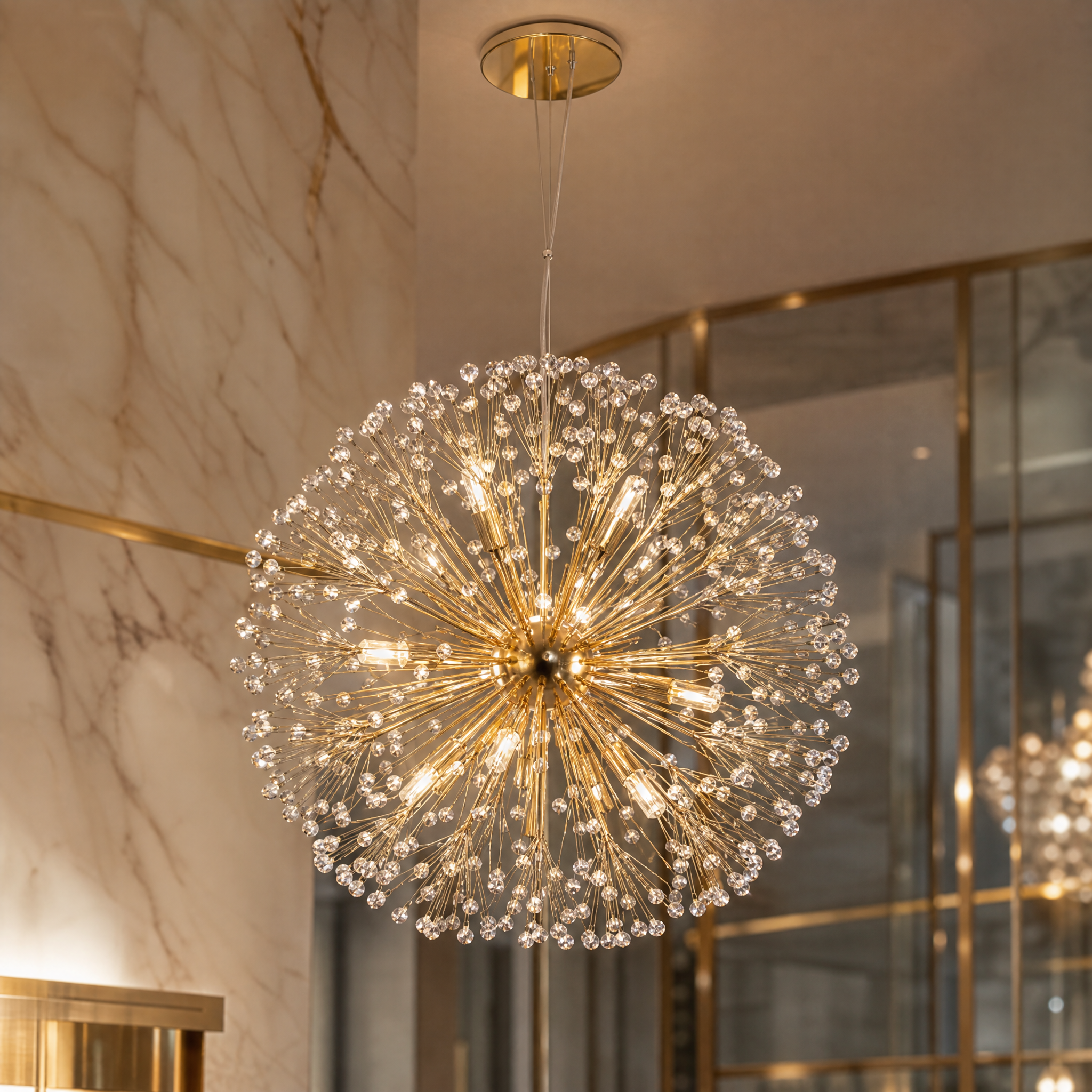 Close-up detail of the handcrafted gold metal work on the Vorelli Kadupul pendant light fixture.