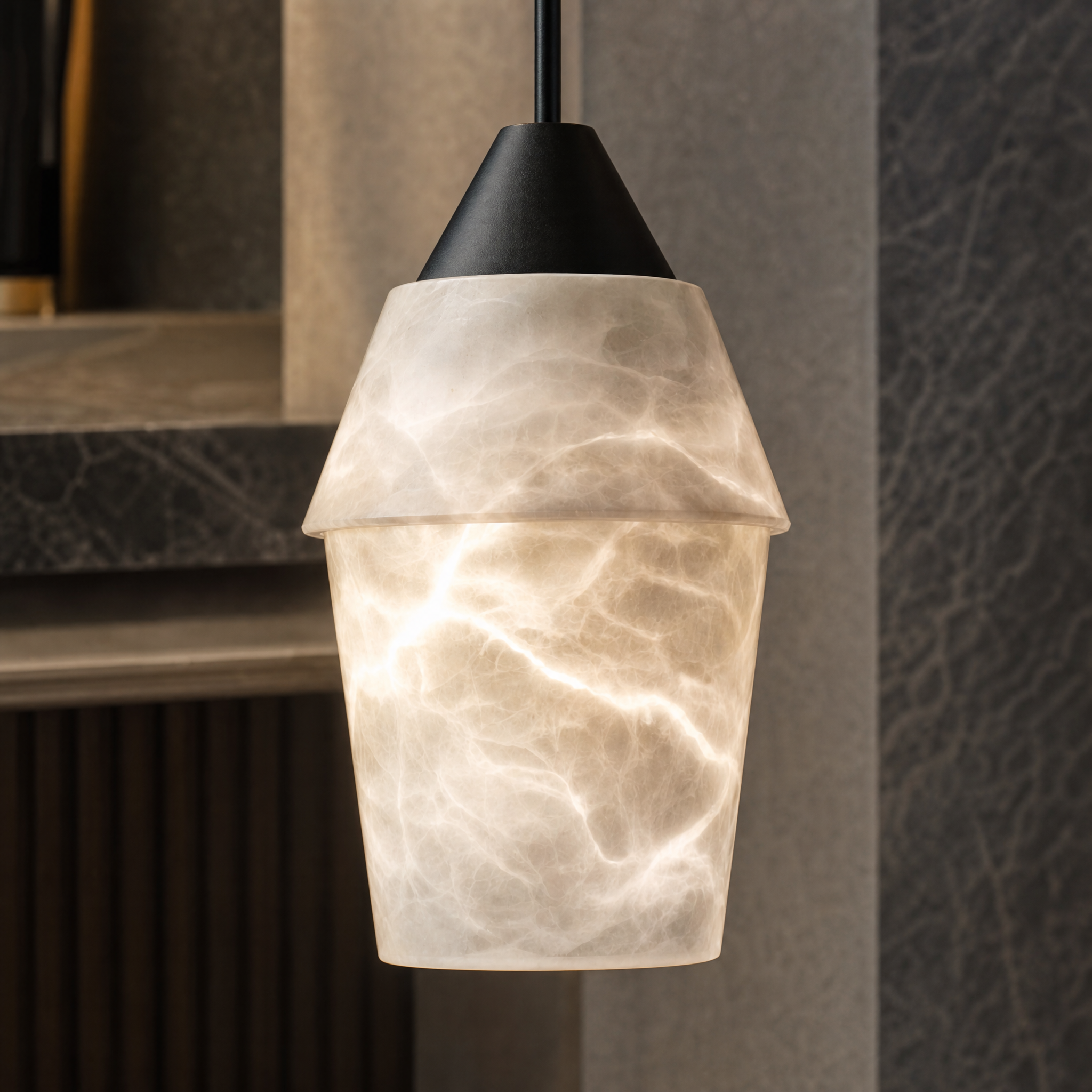 Detailed macro shot of the natural marble texture and refined silhouette of the Kalia Pendant Light II.