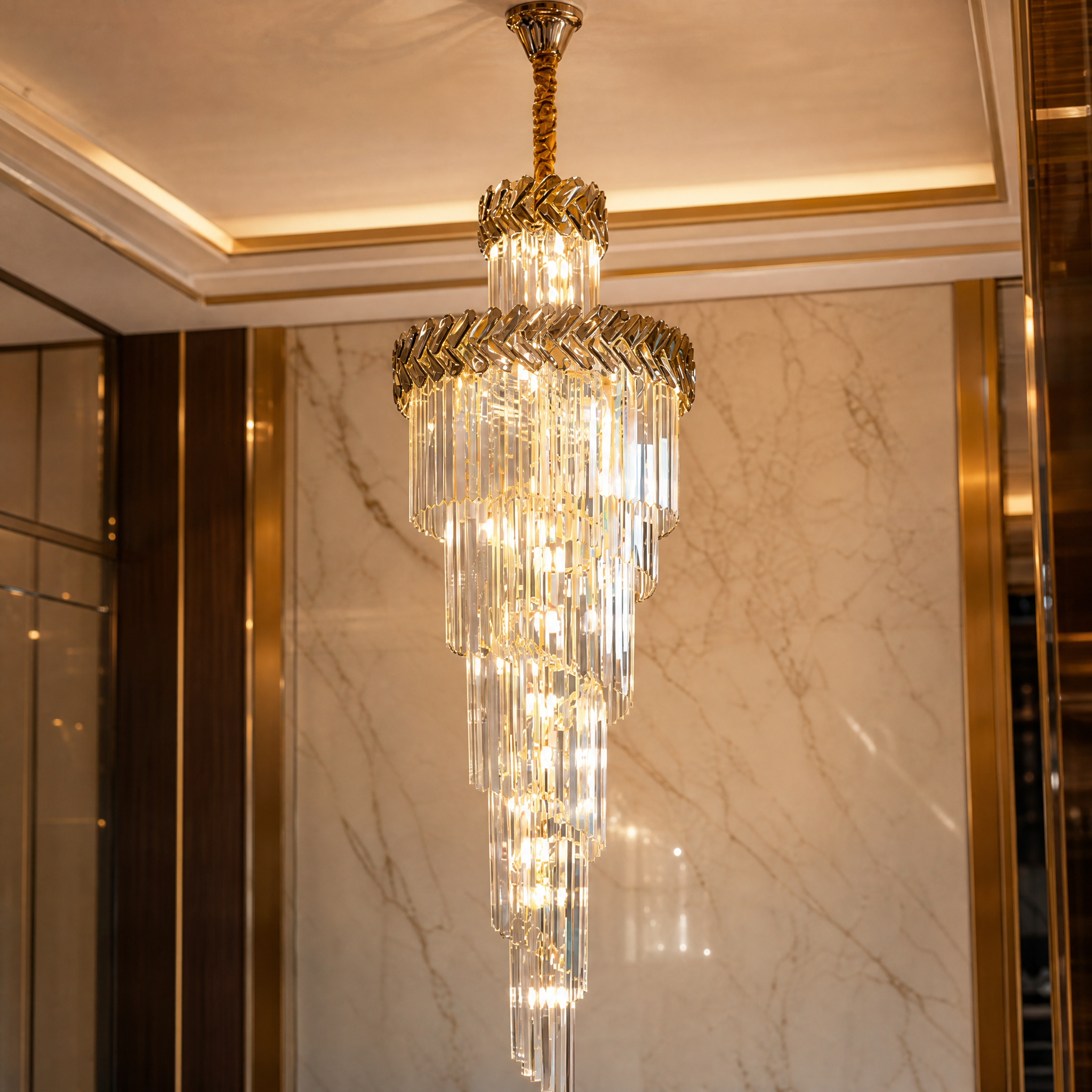 Close-up macro shot of the VORELLI Knightsbridge chandelier highlighting the exquisite crystal bars and the striking chevron crystal frame detail.