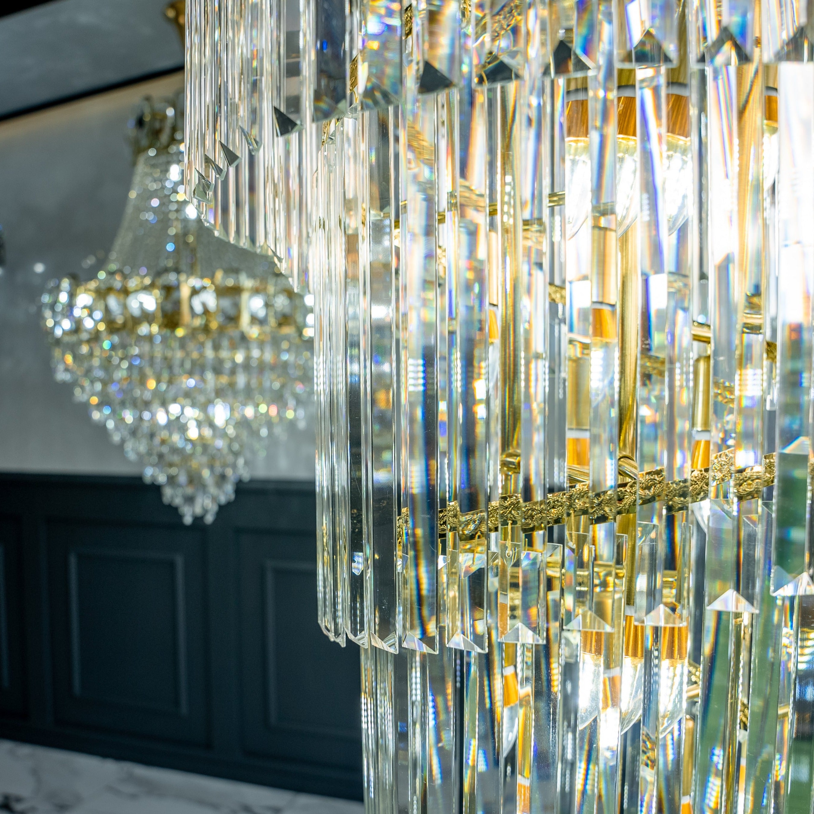 Side view of Knightsbridge staircase chandelier suspended through a multi-level luxury home stairwell
