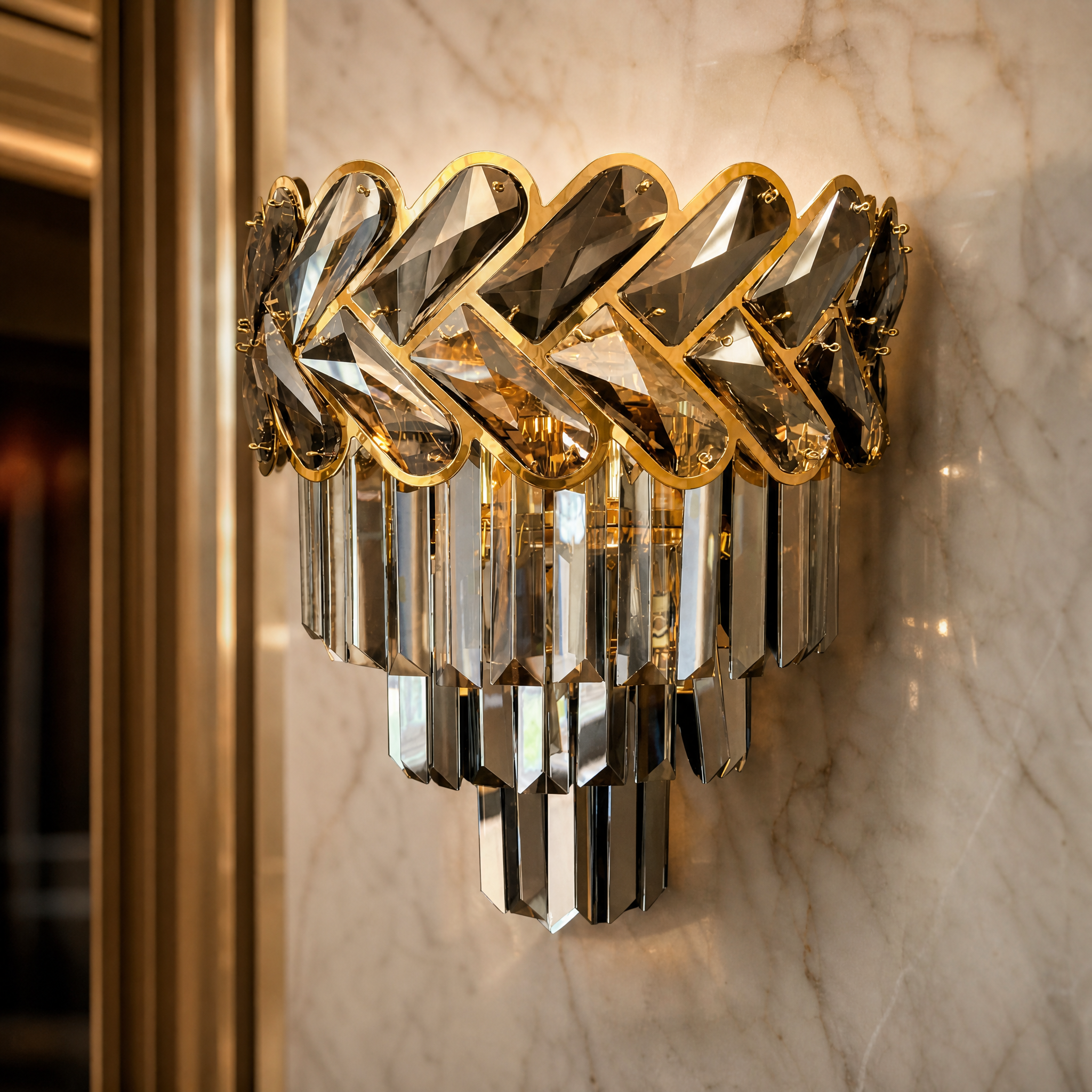 A detailed closeup of the VORELLI Knightsbridge wall light showcasing its intricate two-tone chevron crystal frame and opulent design.
