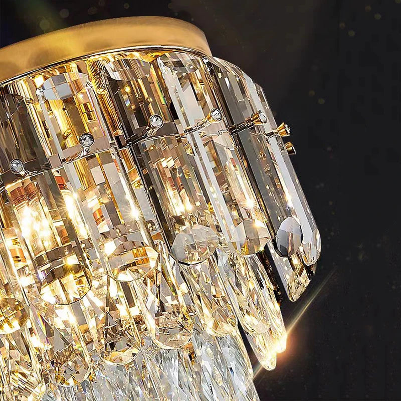 Close up of Lugano Ceiling Light II showing layered diamond cut crystal prisms and gold frame