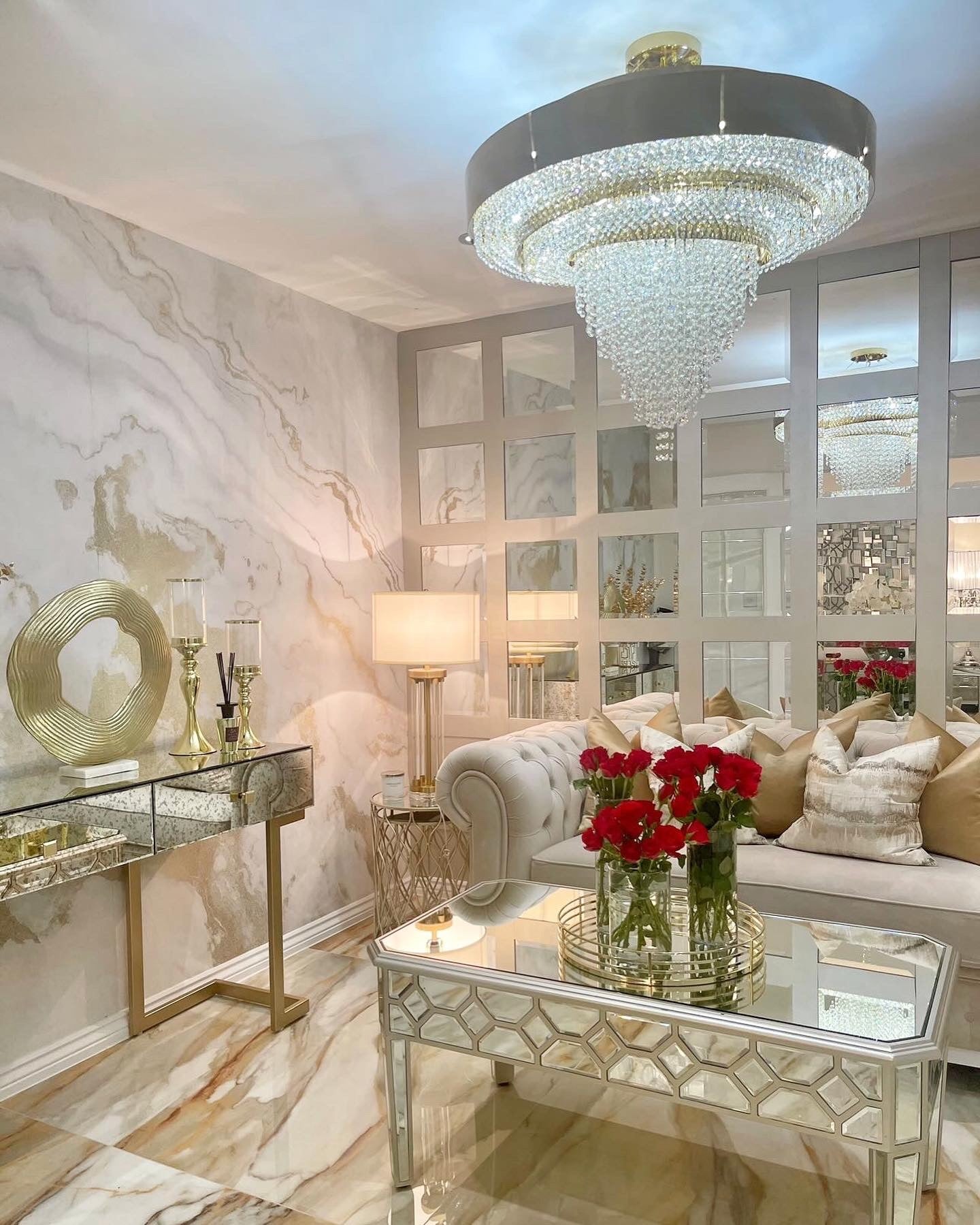 Luxury circular crystal chandelier styled in an elegant interior with soft neutral tones and polished finishes