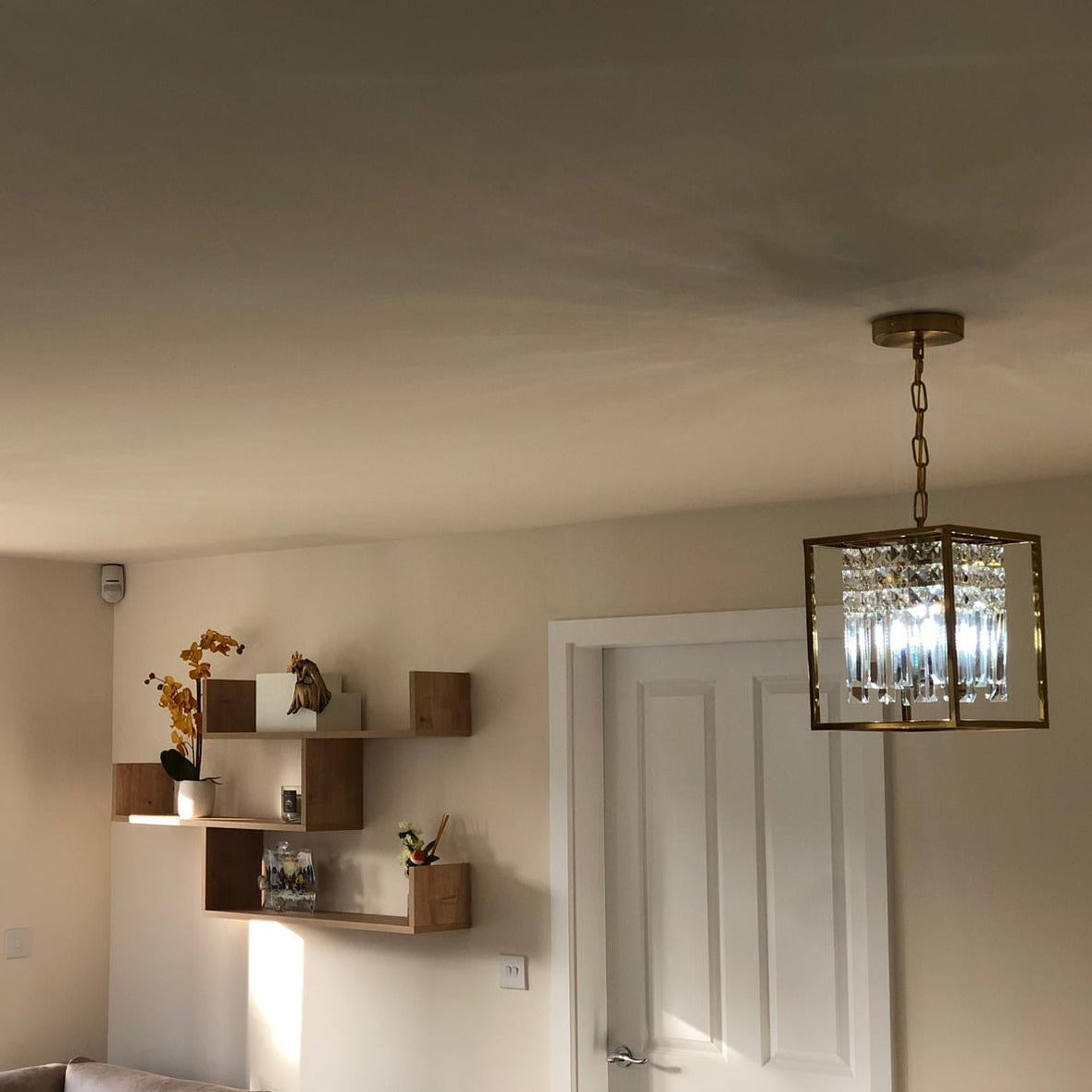 Maddison cube pendant light illuminating a modern interior space