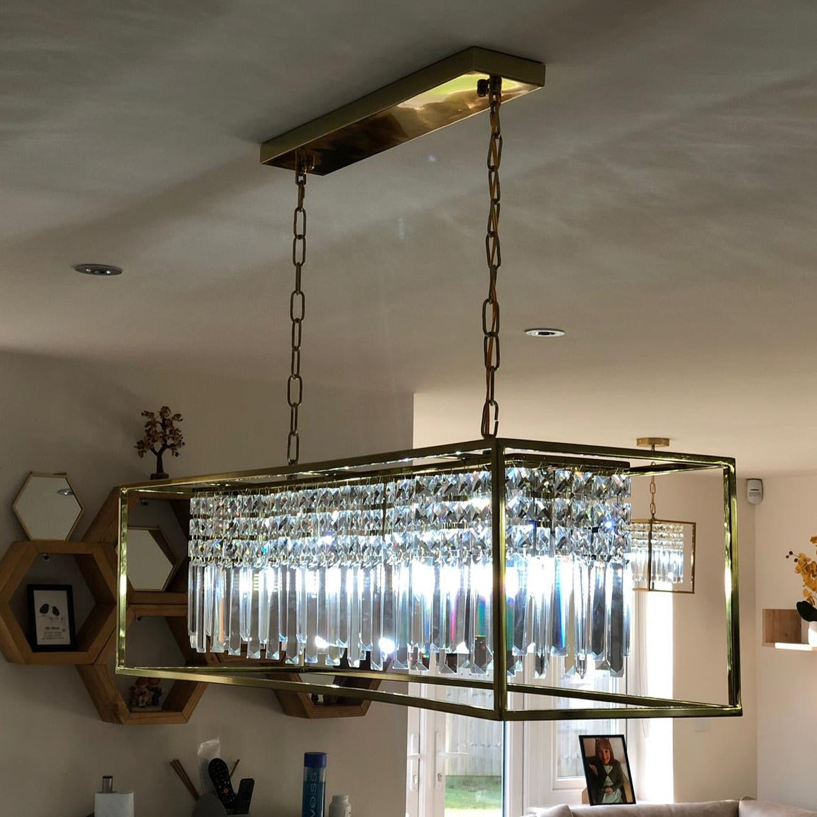 Maddison rectangular chandelier illuminating a modern luxury interior
