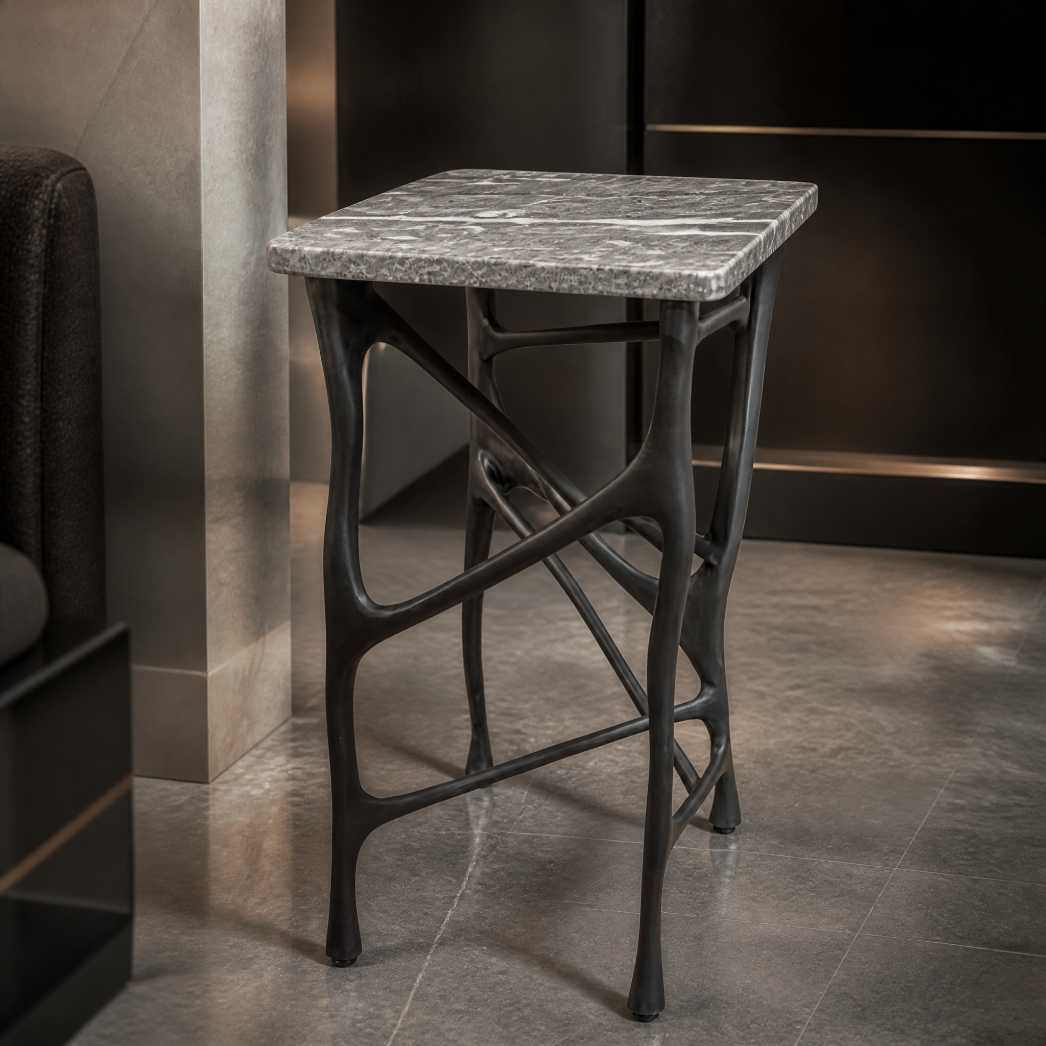 Close-up detail of the smooth warm grey marble grain on the Vorelli Merano side table.