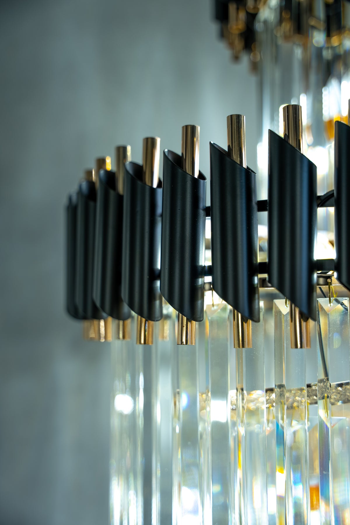 Detailed crystal and light refraction on a luxury VORELLI® staircase chandelier