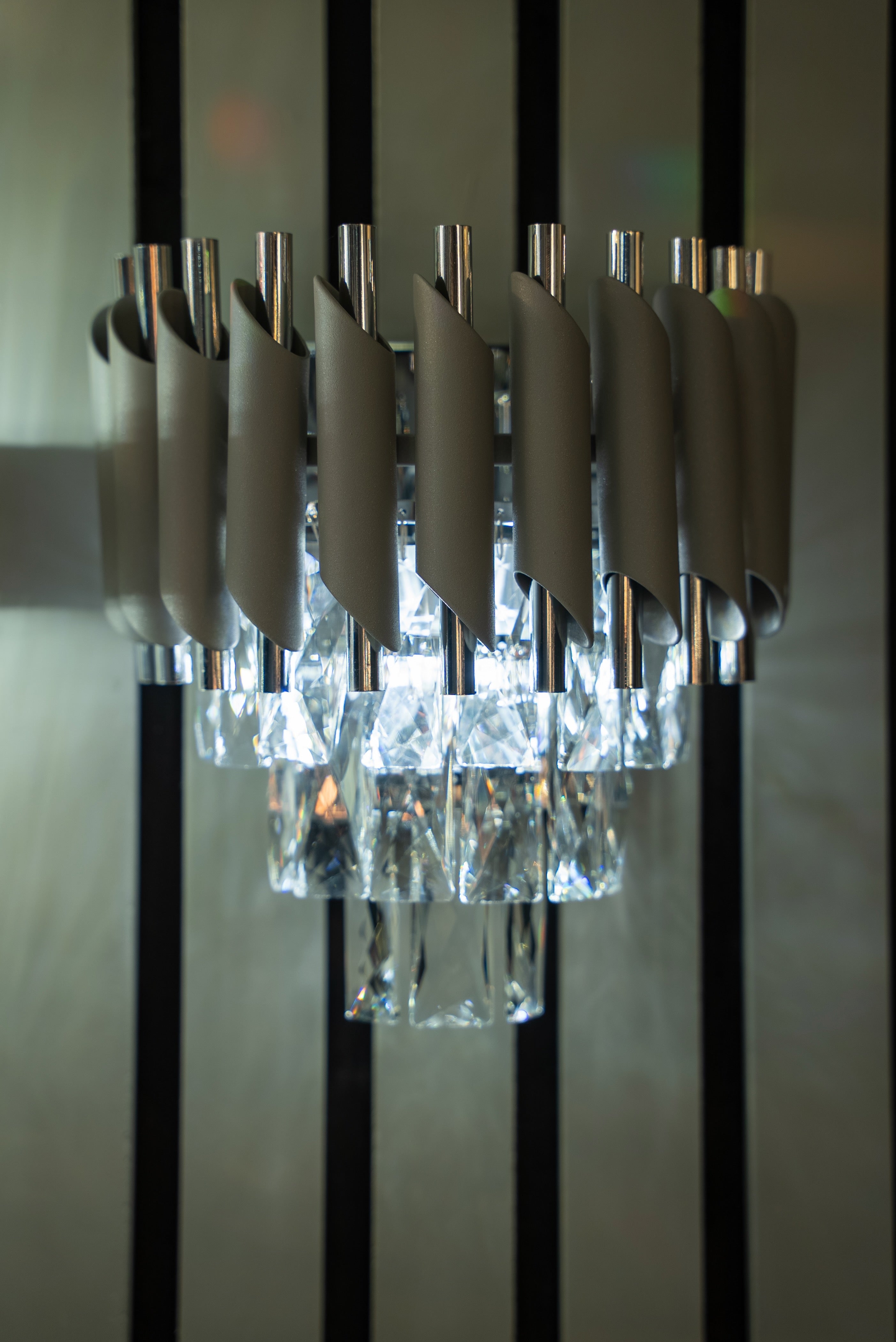 Milltimber wall light showcasing refined cylinder tubing and precision cut crystal detailing