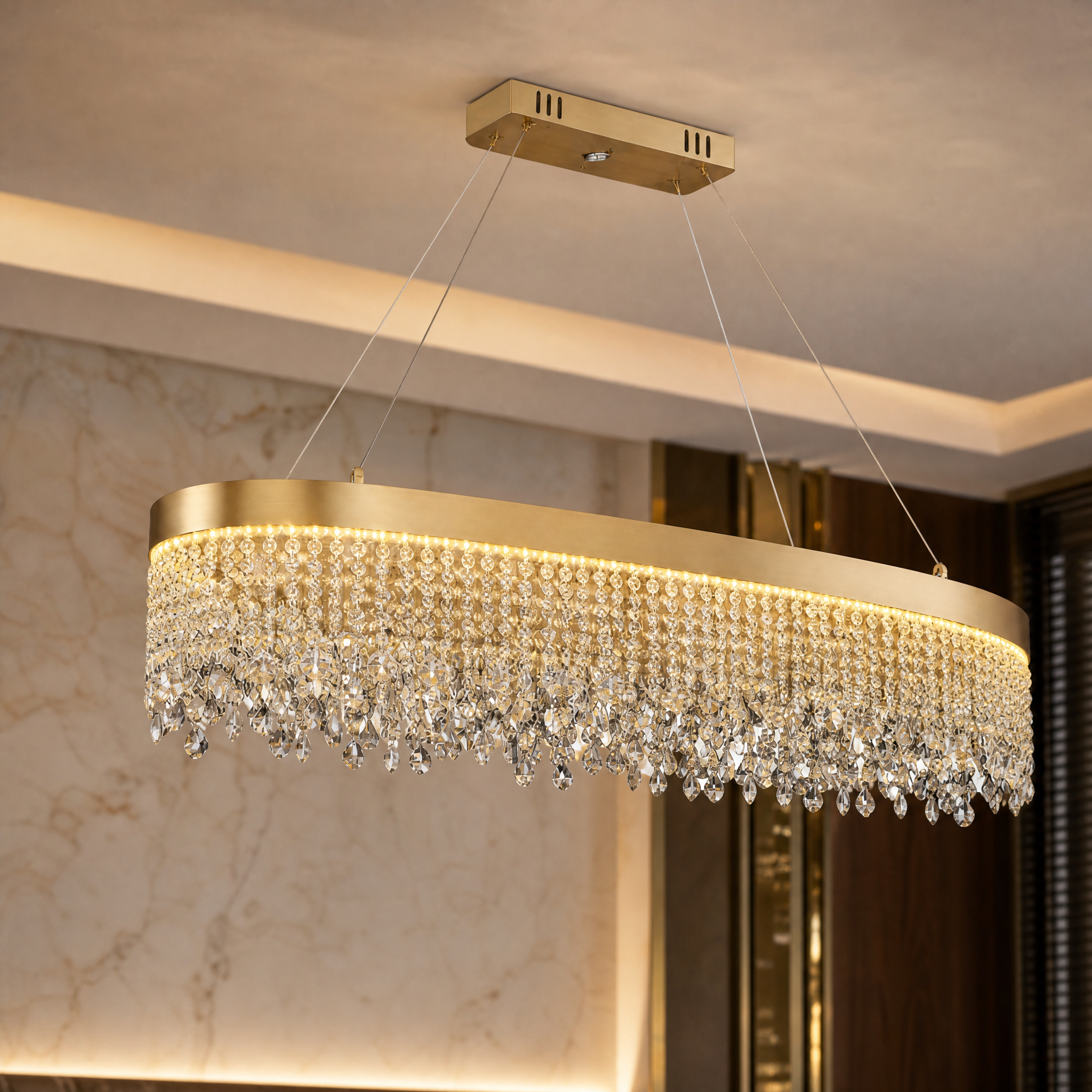 Macro closeup of the diamond-cut crystal chains and sleek stainless steel frame on the VORELLI Modesto oval rectangular chandelier.