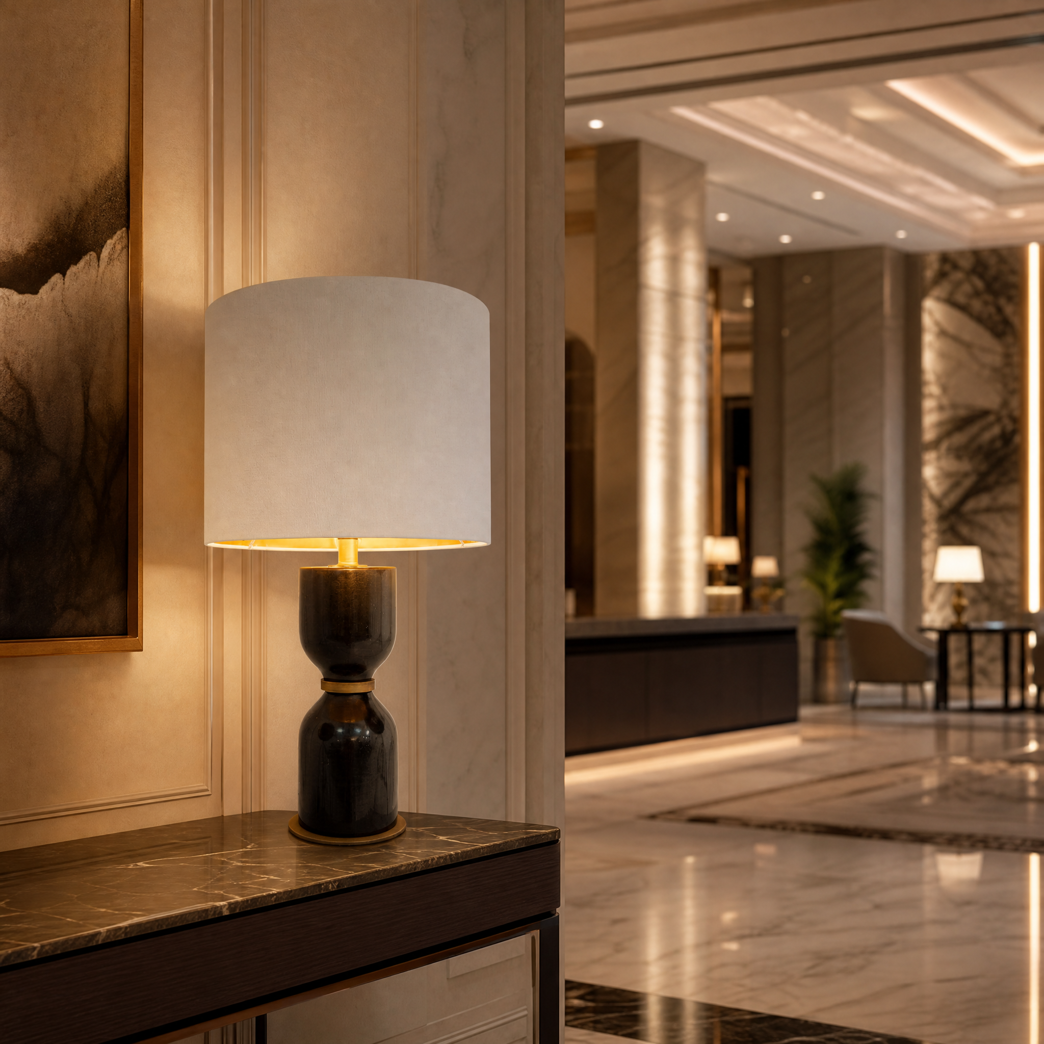 Elegant Noiré black marble lamp placed on a hotel nightstand to provide warm ambient lighting