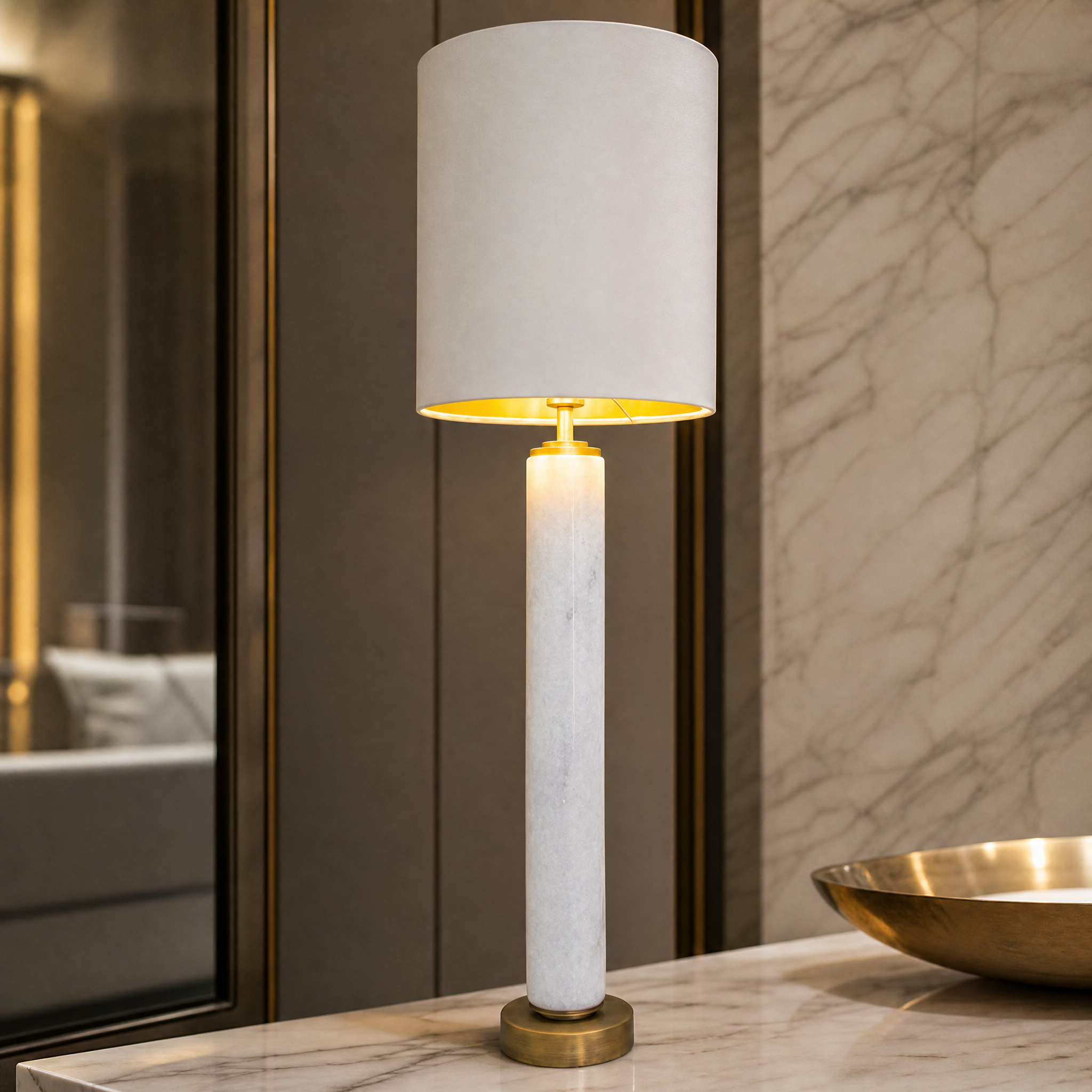 A detailed close-up of the VORELLI Norvello lamp highlighting the refined architectural silhouette of white marble and antique brass detailing.