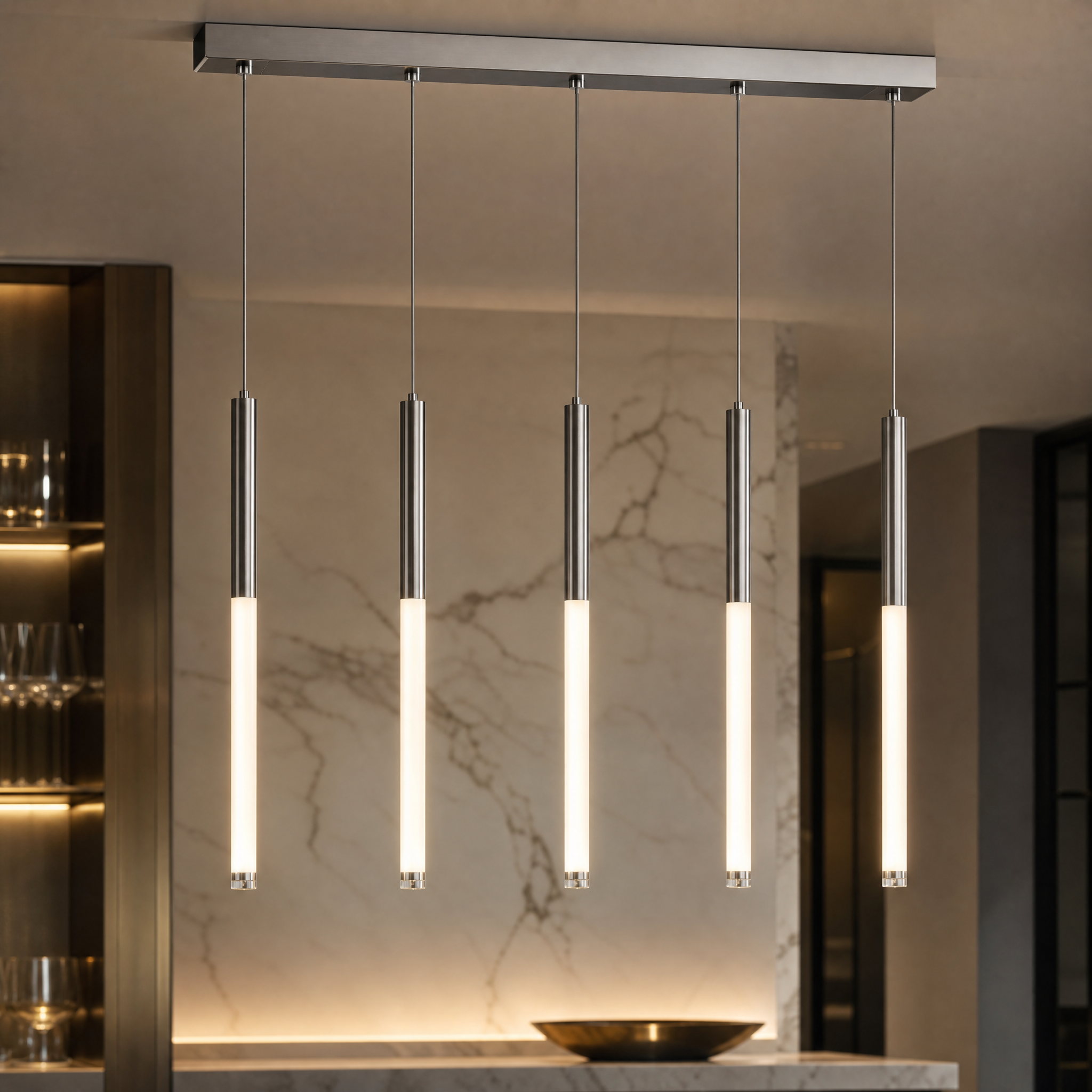 Macro closeup of the VORELLI Nyon rectangular chandelier highlighting the intricate bubble effect within the crystal and the polished stainless steel cylinder finish.