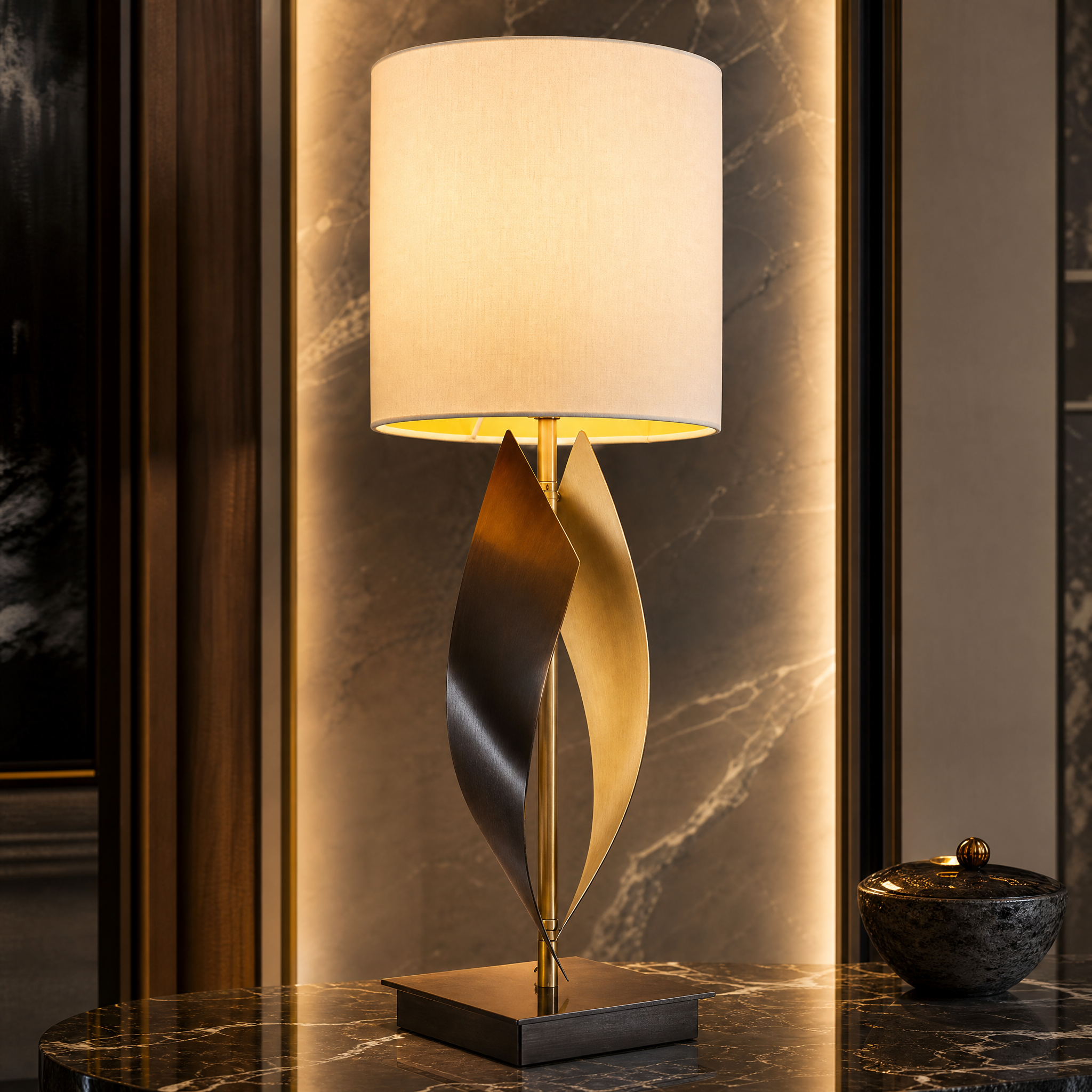 Close-up detailed view of the VORELLI Orvessa table lamp showcasing the artistic sculptural movement of the twisted antique brass base and refined cream fabric shade texture.