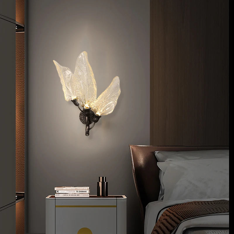 Designer Ottobre wall light creating ambient lighting in a modern bedroom