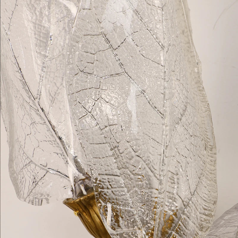 Close-up of textured glass leaf detailing on the Ottobre wall light