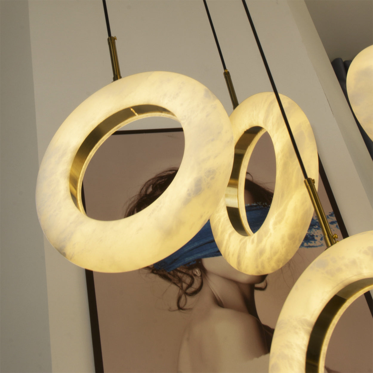 Statement Pietra chandelier suspended in architectural double-height living space