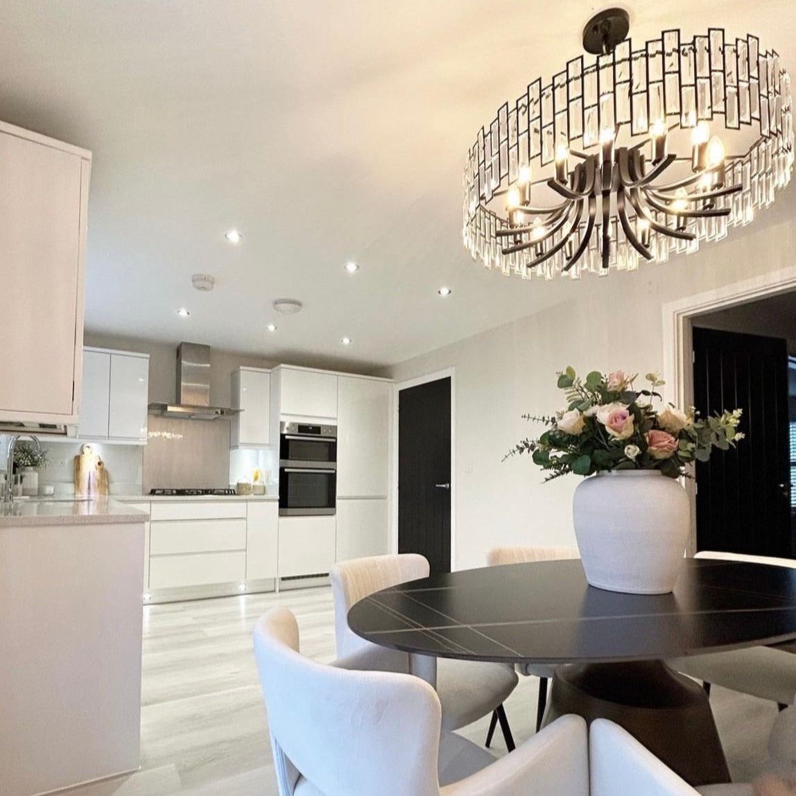 Presidio Circular Chandelier II visible above staircase highlighting refined rectangular crystal frame