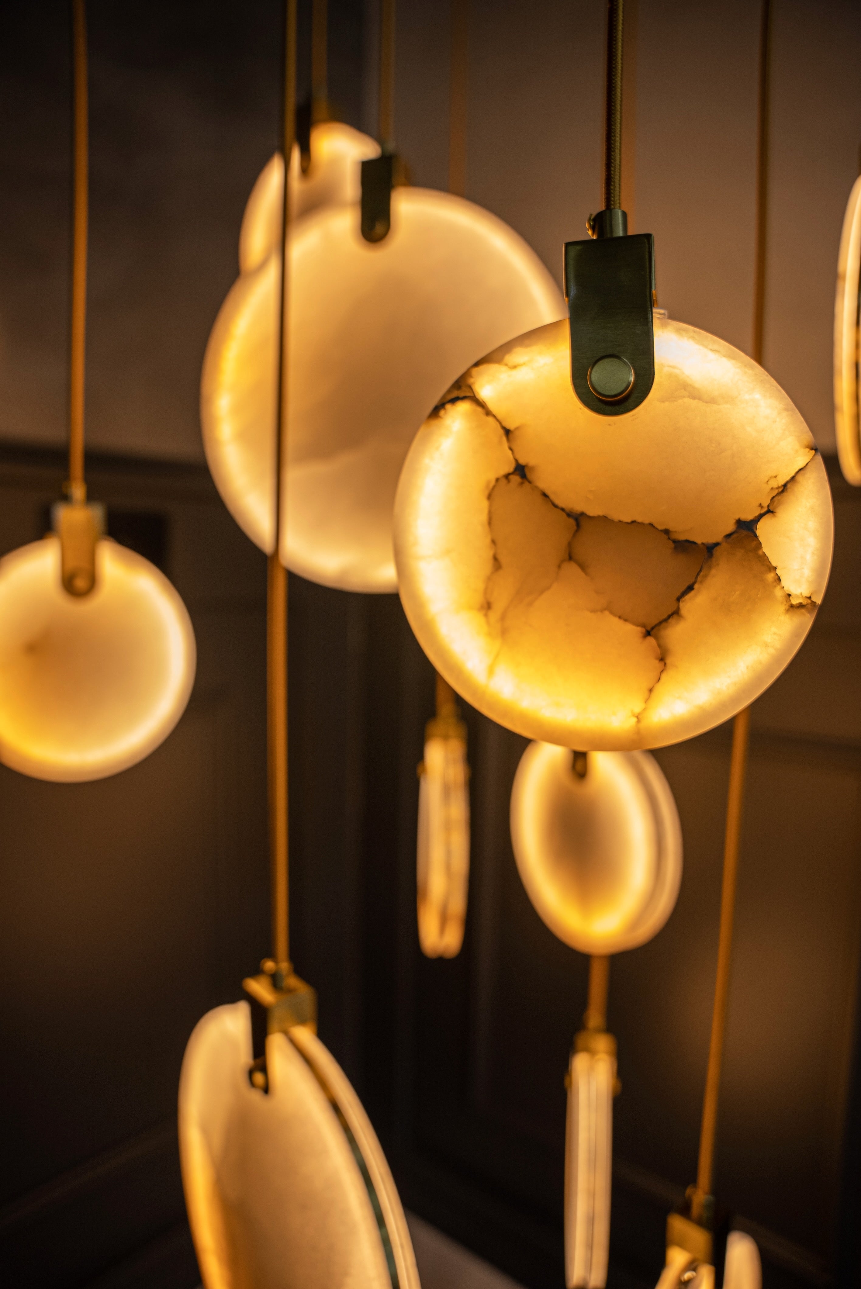 Video of VORELLI® Calacatta marble staircase chandelier showing scale, movement and ambient lighting.