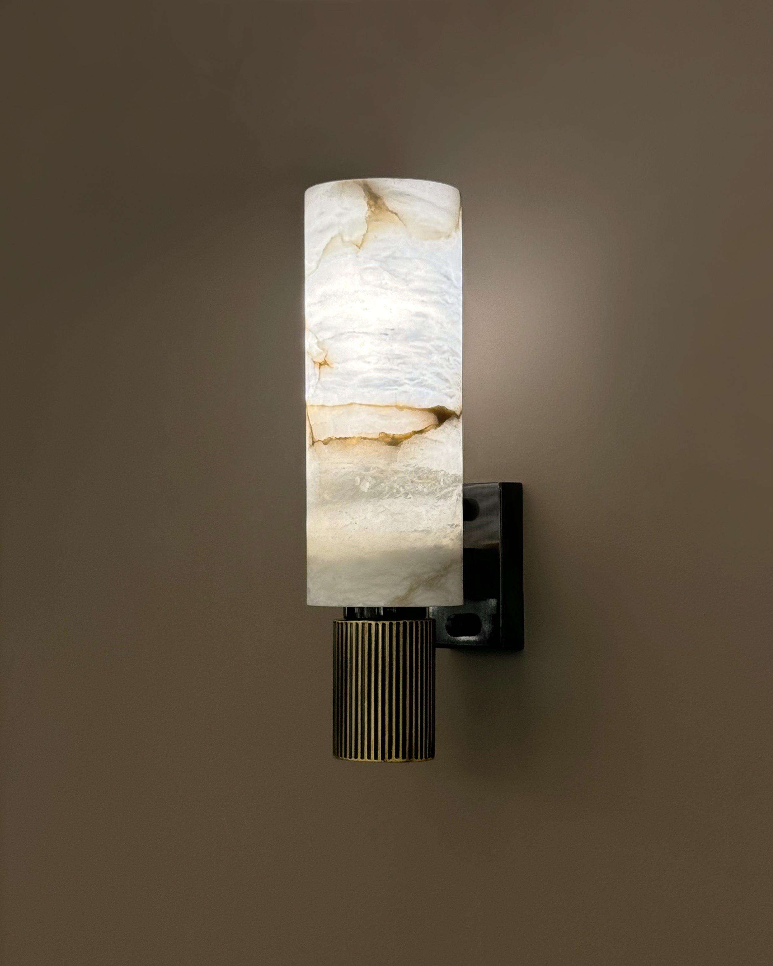 Riviera luxury marble wall light installed in refined interior creating soft ambient glow