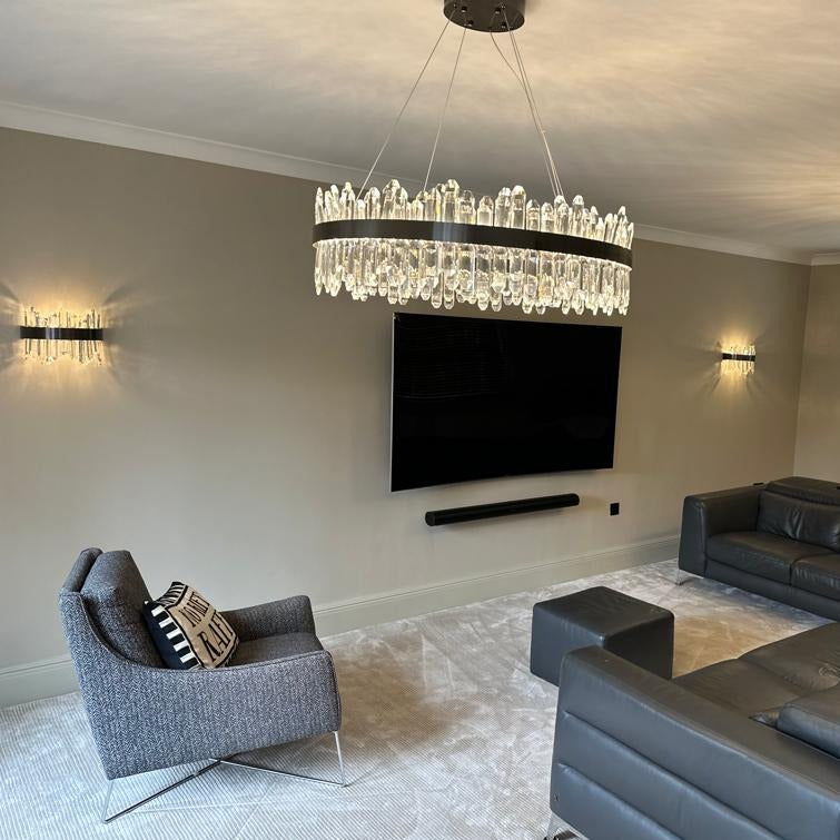 Sagres circular diamond cut crystal chandelier mounted close to ceiling in modern interior