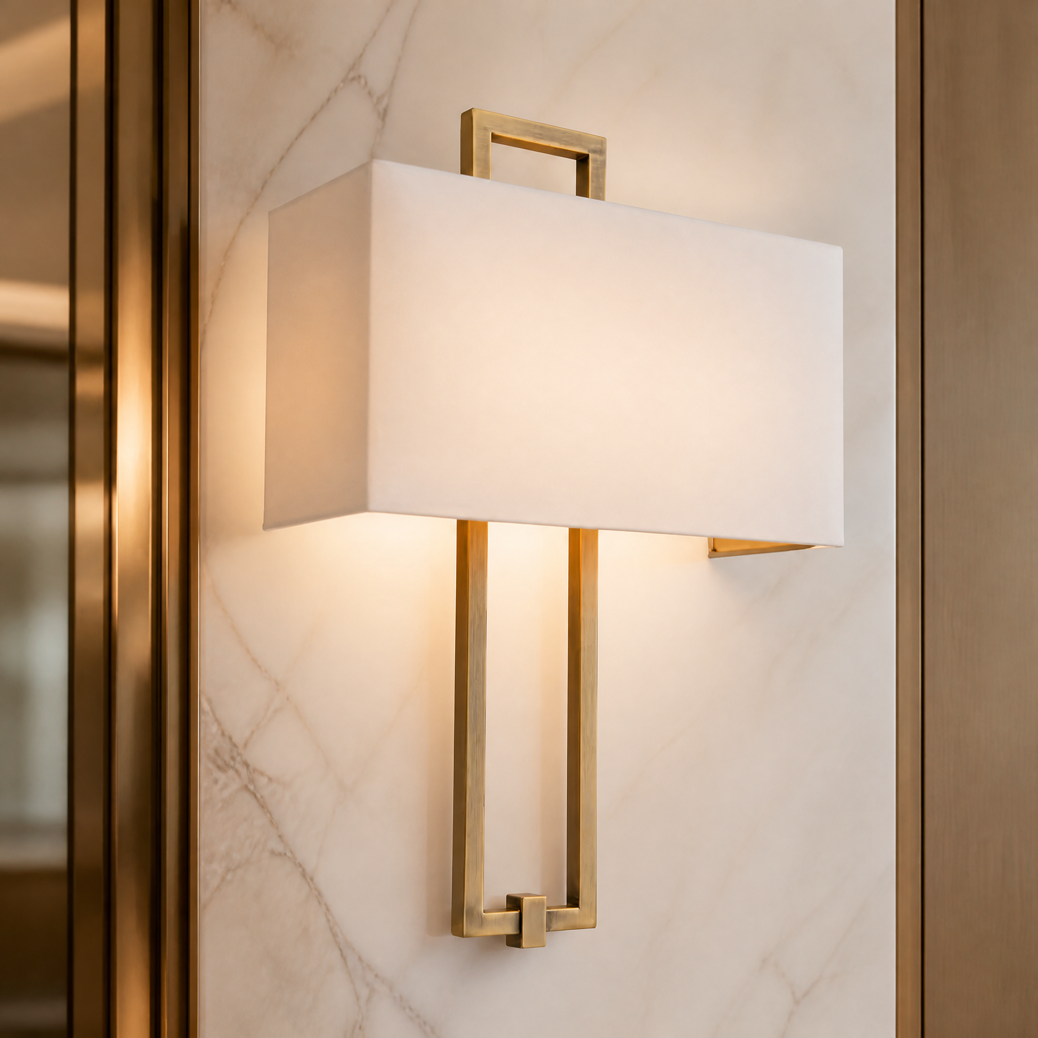 A detailed closeup of the Savona Wall Light, emphasizing the premium texture of the fabric shade contrasted with the sharp angles of its geometric frame.
