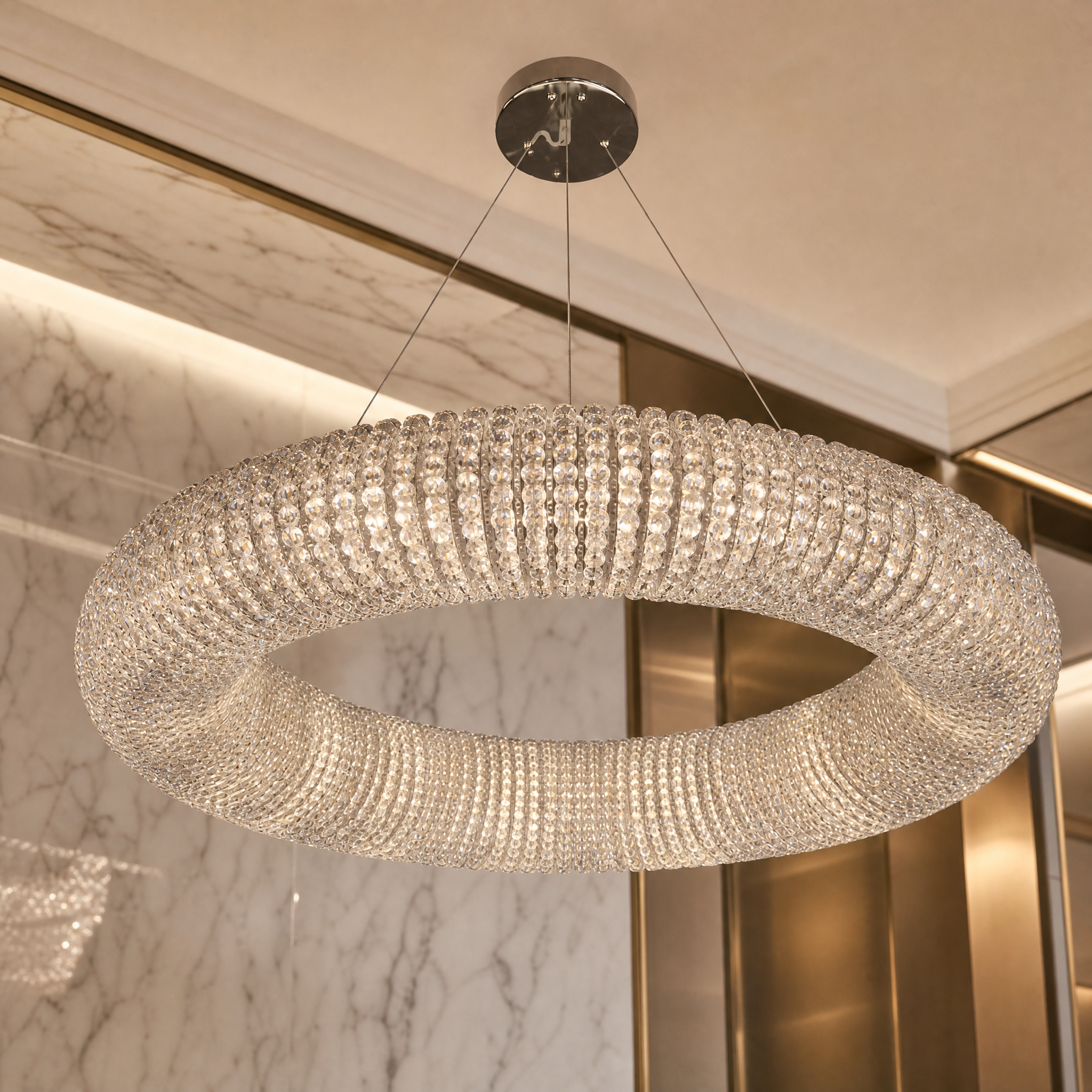 A detailed closeup showcasing the exquisite diamond-cut crystal pearls encircling the sleek ring frame of the VORELLI Seminyak chandelier.