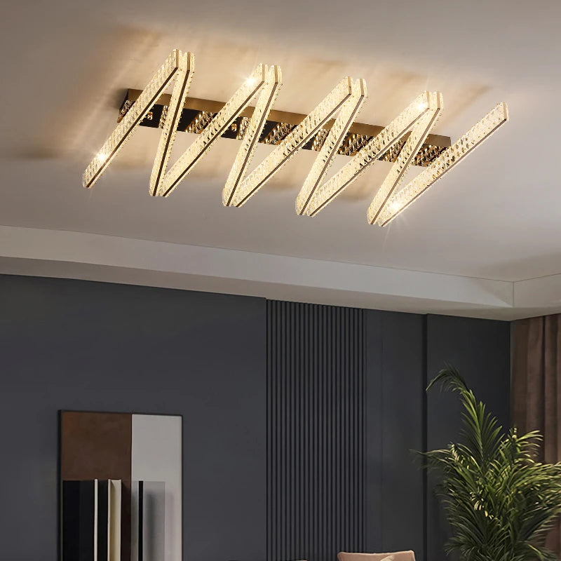 Signature modern linear crystal ceiling light installed in contemporary living interior