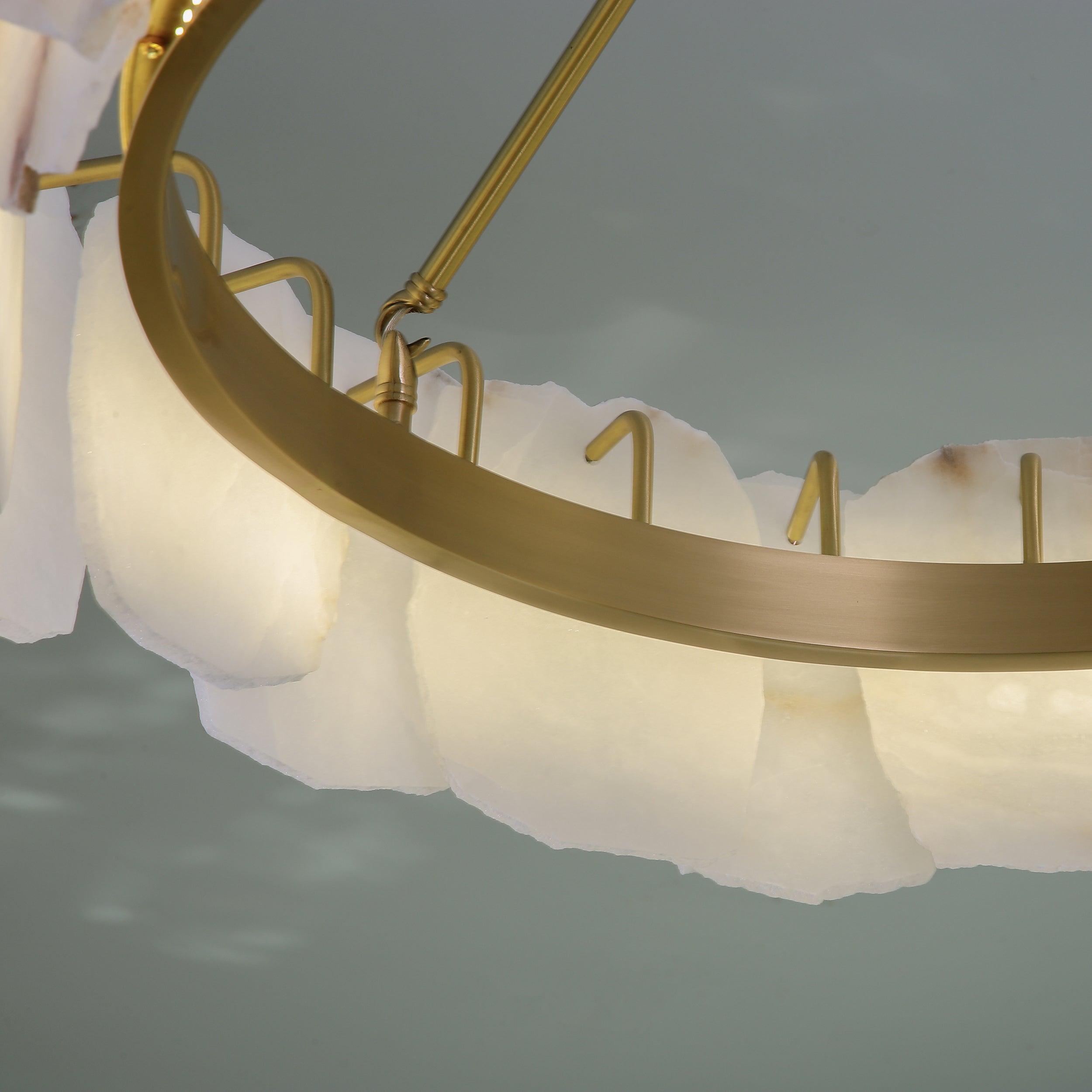 Detailed view of marble panels and circular frame structure on Silvio Marble Circular Chandelier II