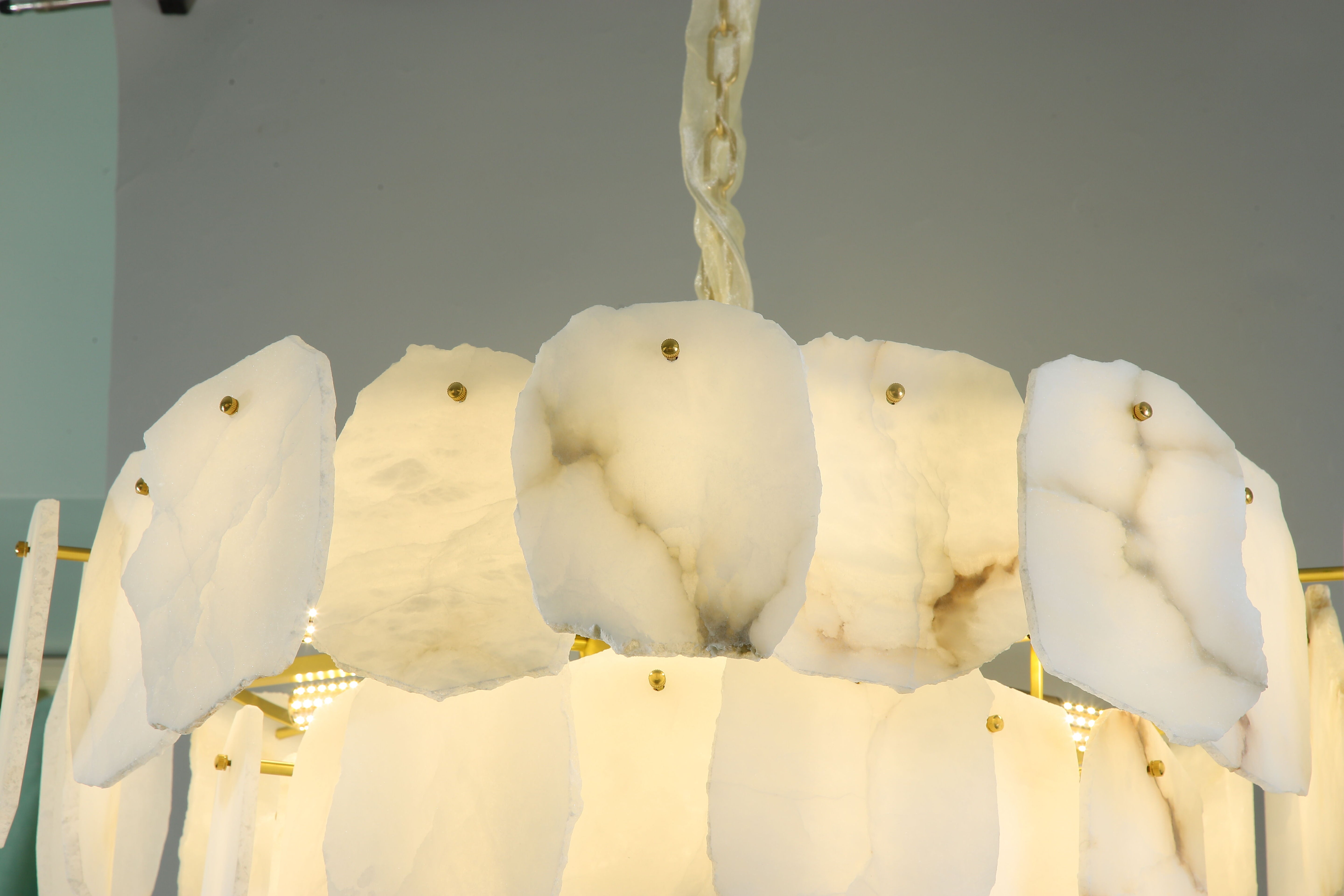 Silvio luxury marble circular chandelier showcasing layered translucent stone panels