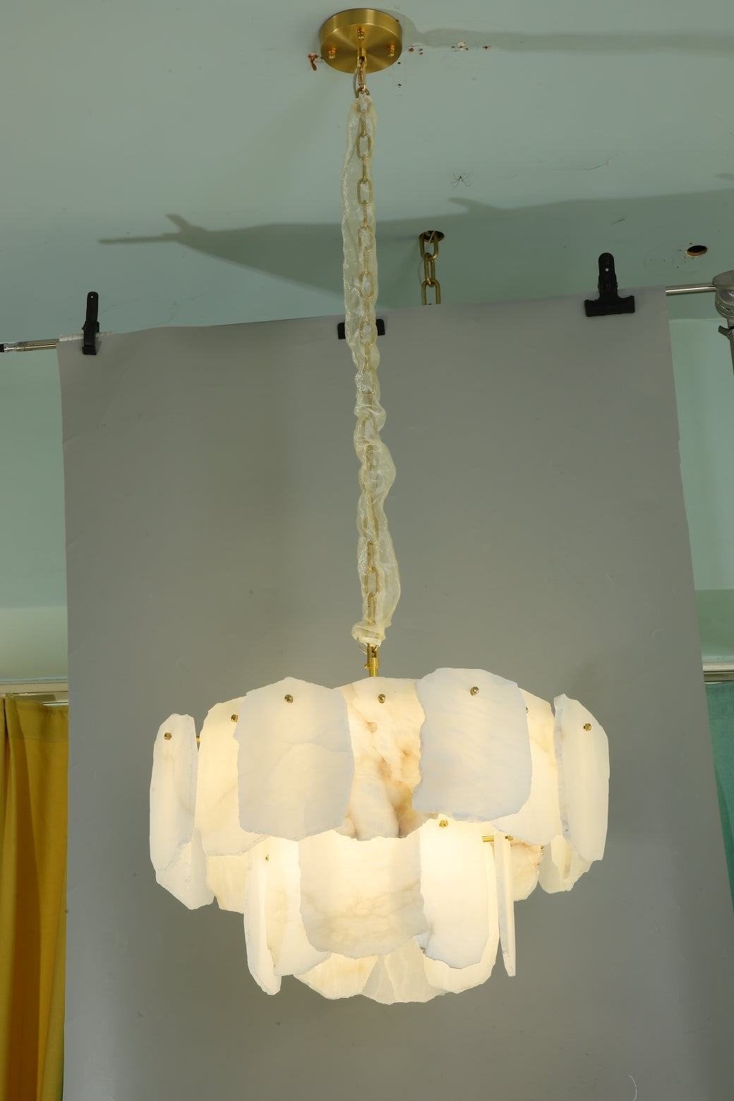 Silvio modern marble circular chandelier installed in upscale interior creating soft ambient glow