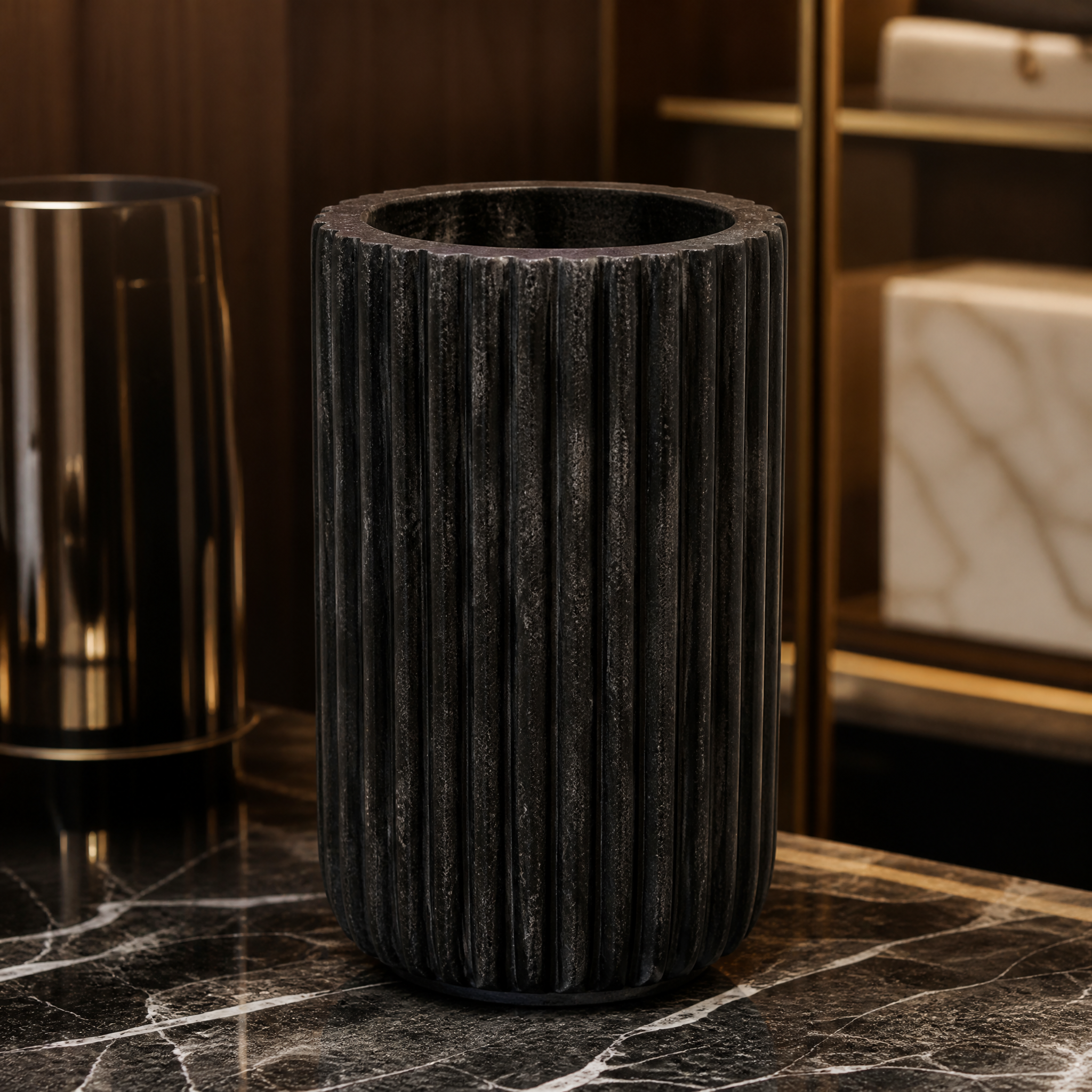 Macro close-up shot highlighting the detailed ribbed surface and polished finish of the VORELLI Solaro deep black marble decorative vase.