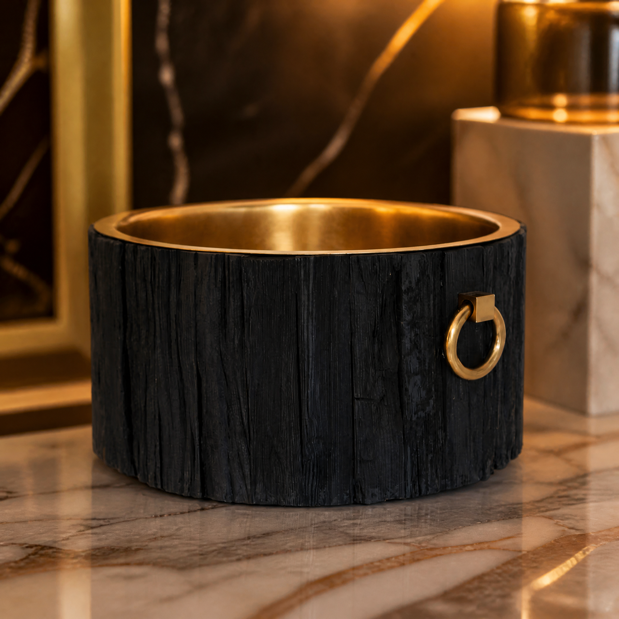 Close-up detail of the Sorriso Champagne Tub highlighting the contrast between the gleaming brass interior and charcoal wood strip exterior.