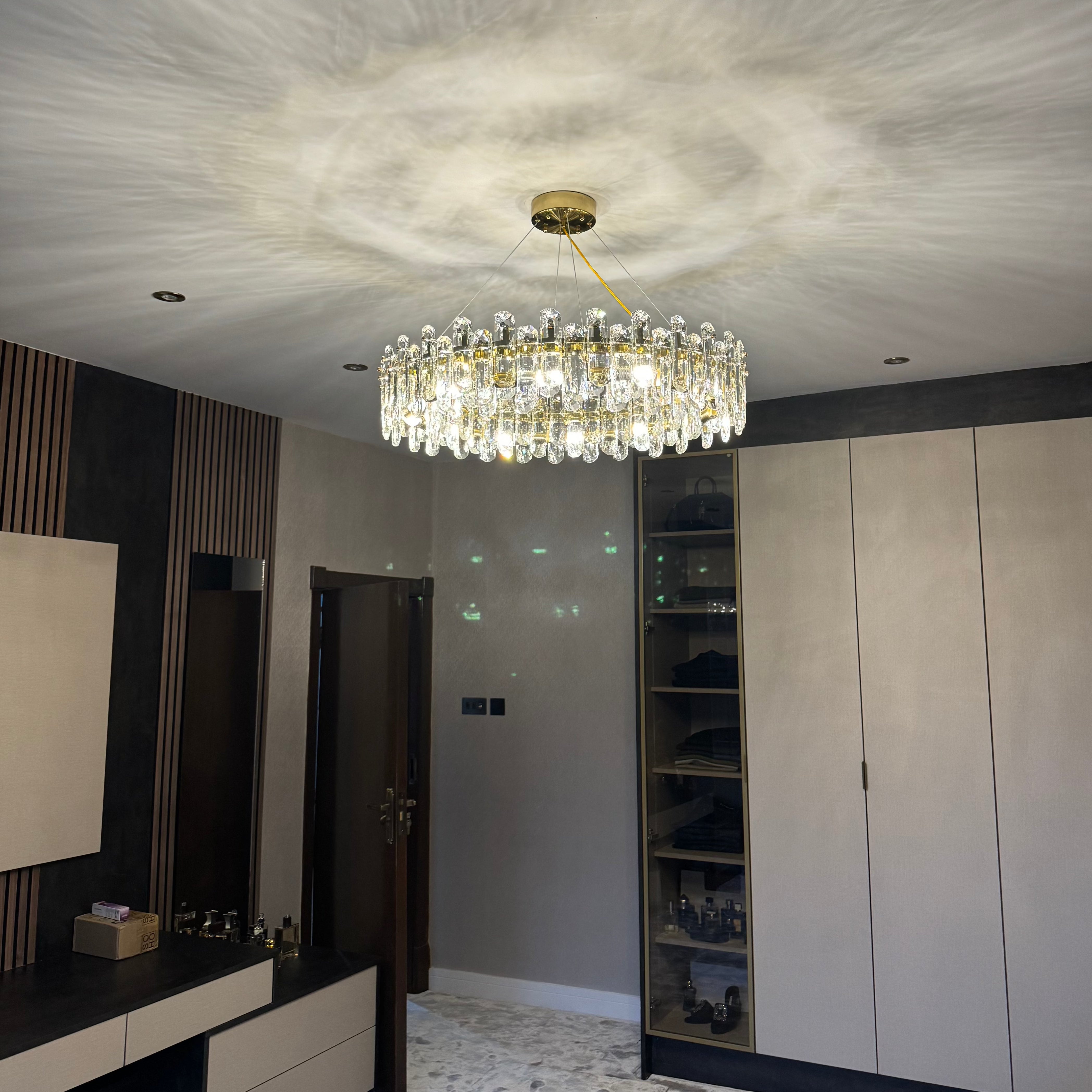 Stellina luxury circular chandelier showcasing textured oblong crystal perimeter
