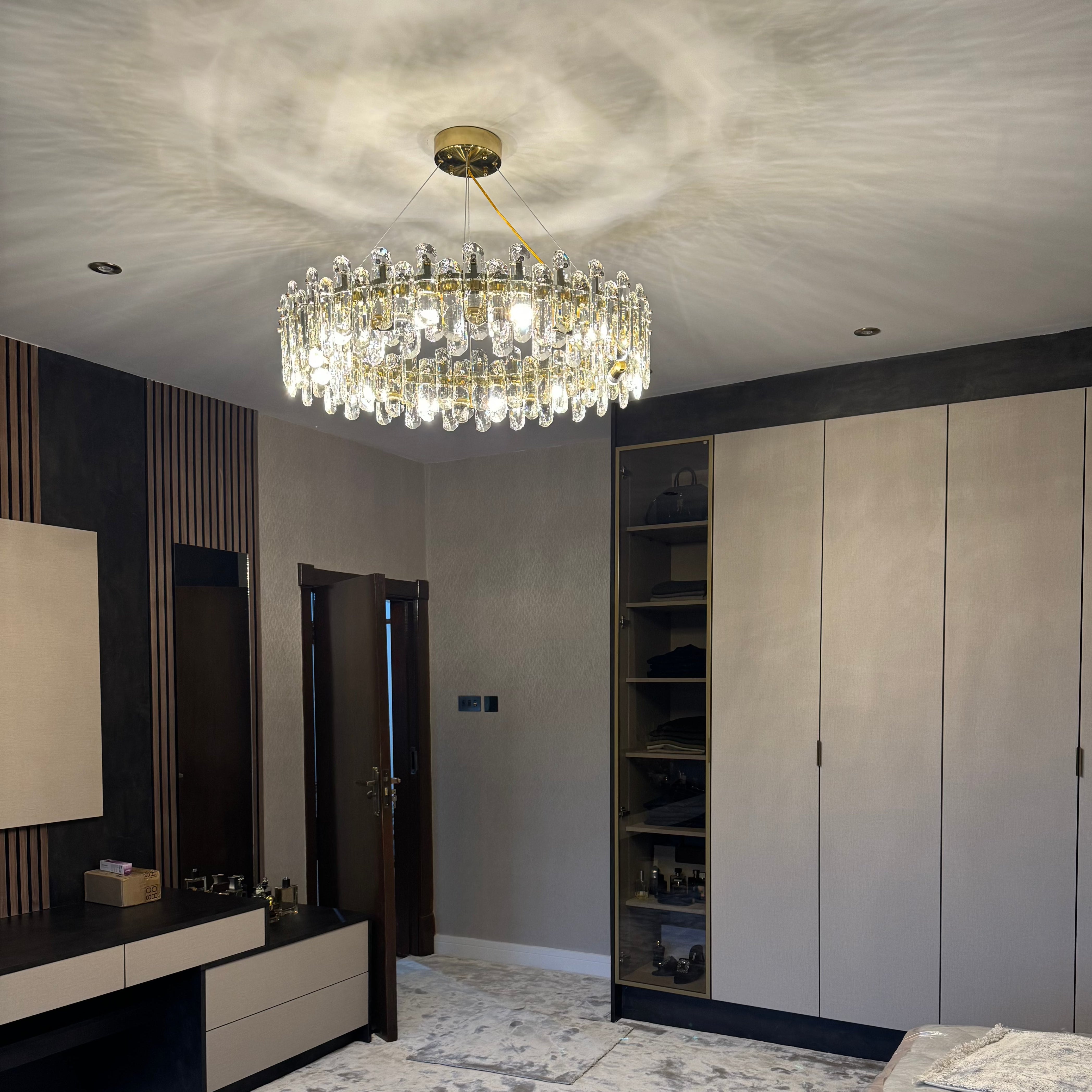 Stellina modern oblong crystal ring chandelier installed in refined living interior