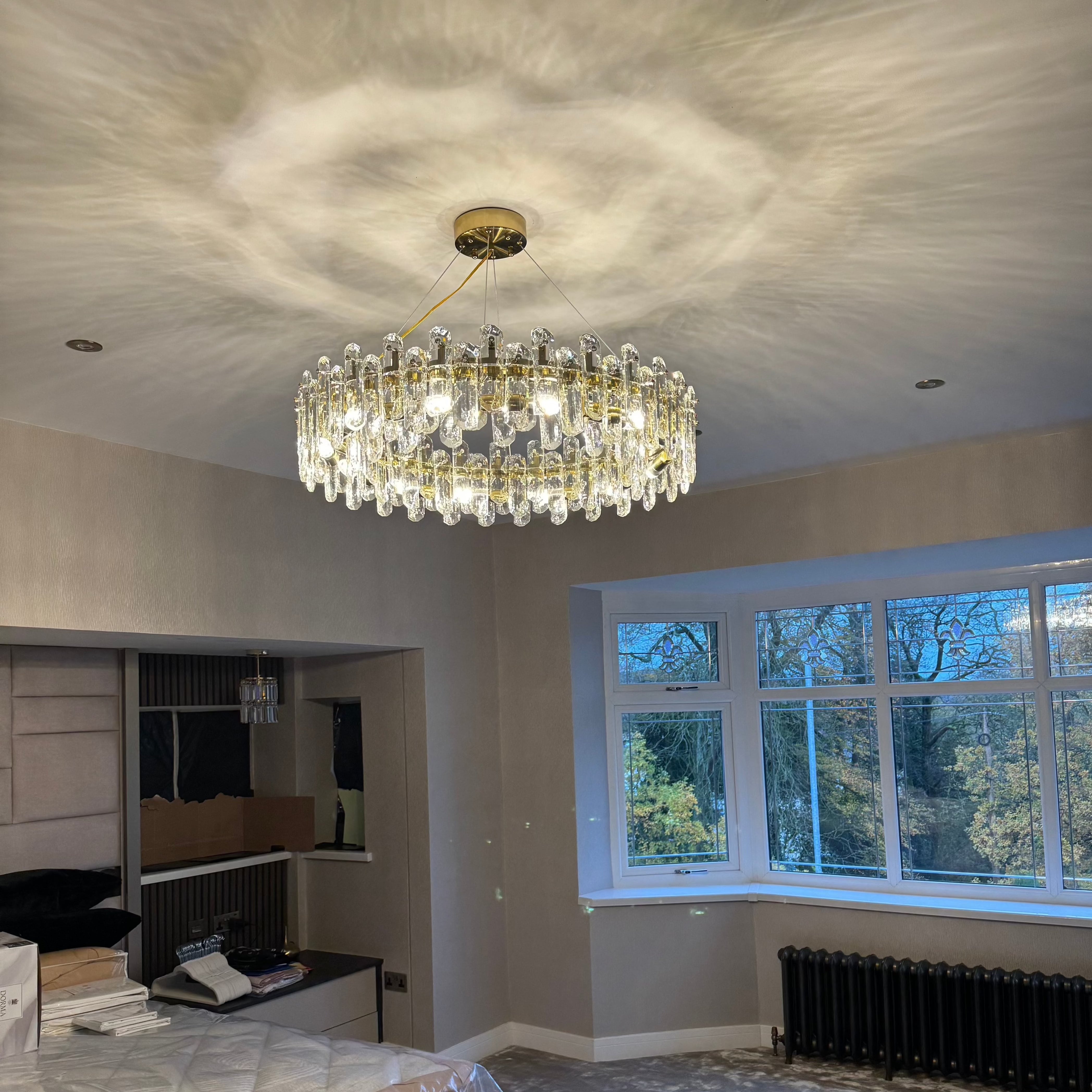 Close up of textured oblong crystal elements on Stellina circular chandelier