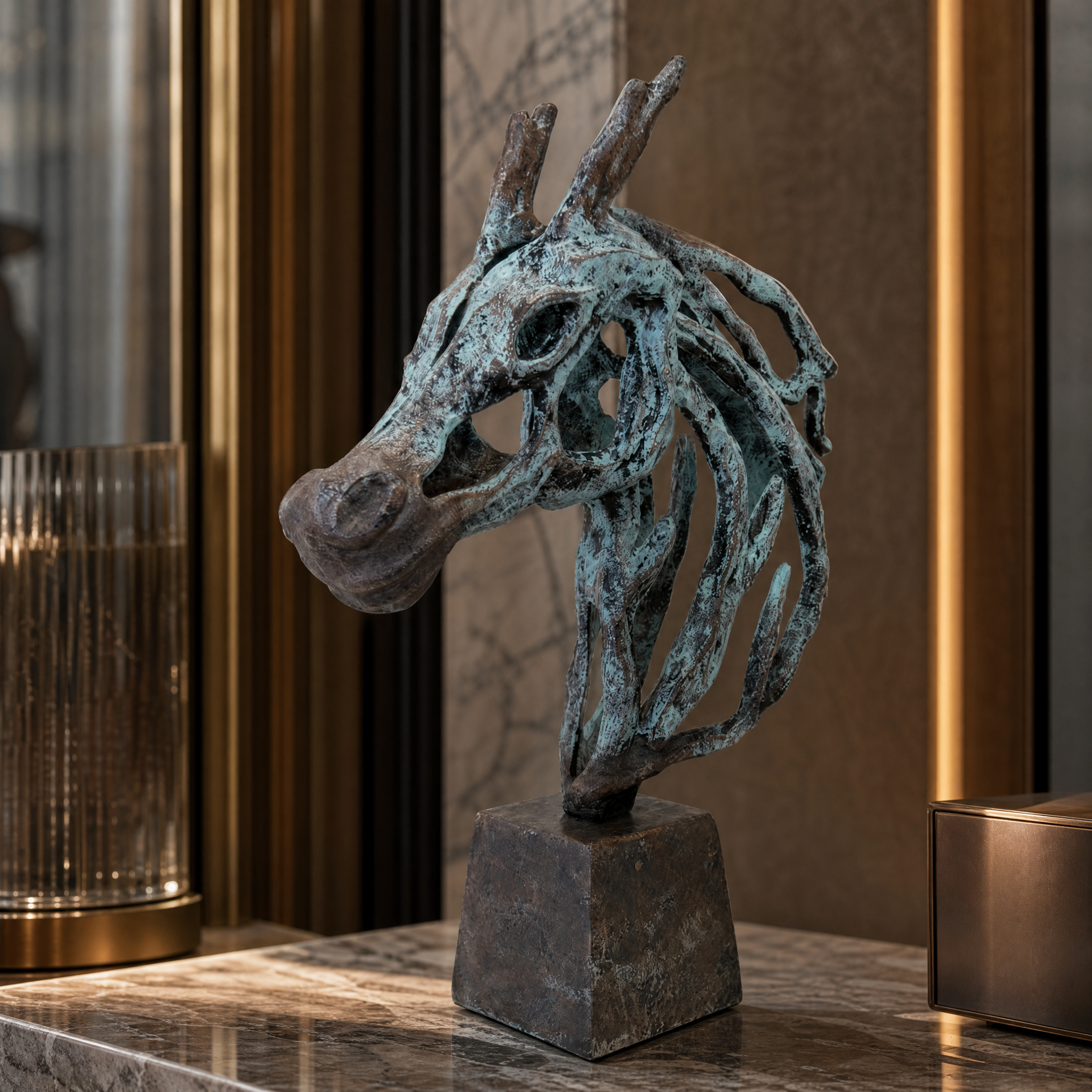 Close up of the Novelli horse head sculpture showing distressed bronze finish and blue undertones