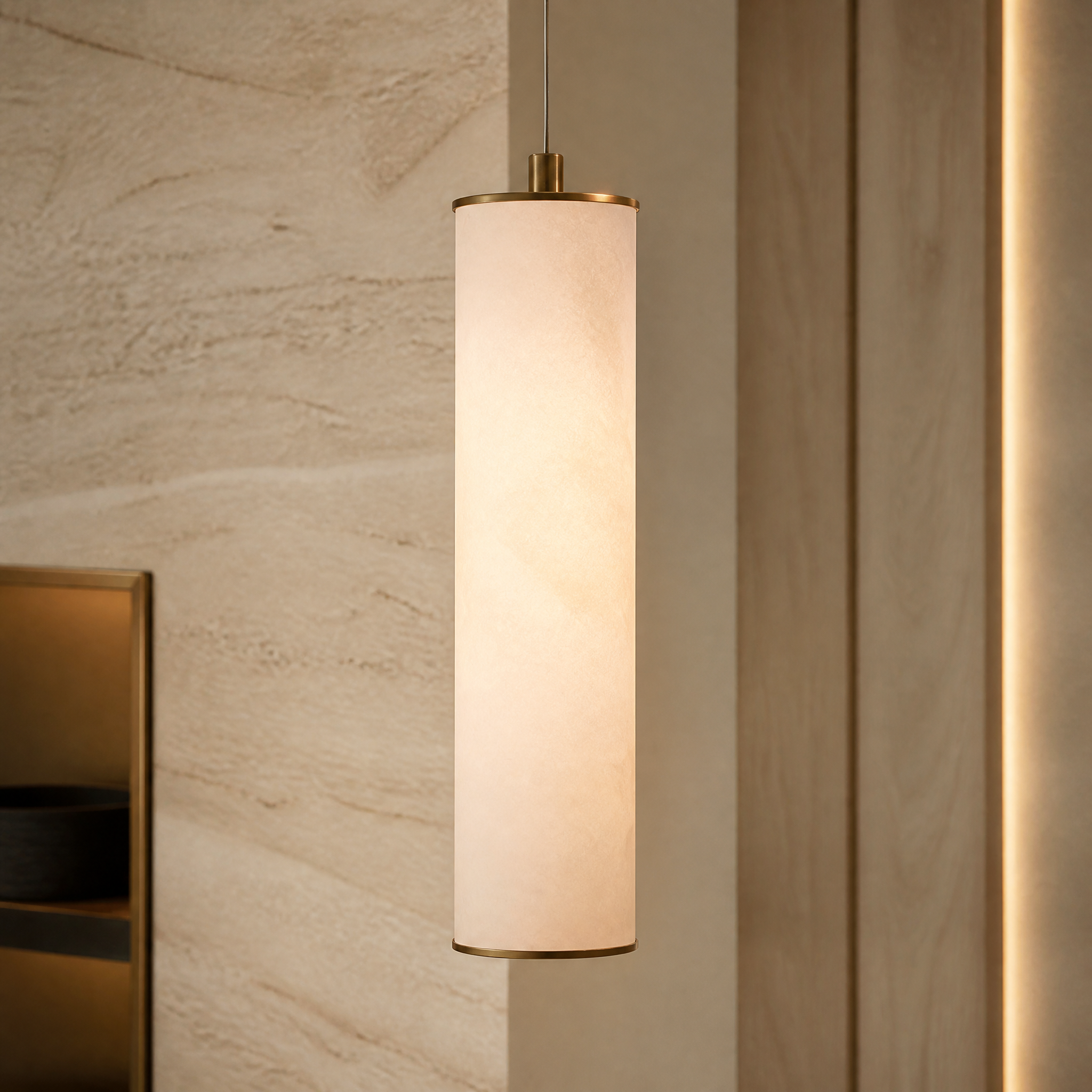 The sleek elongated form of the Alvara marble pendant light illuminating a contemporary living space with sophisticated minimalism.