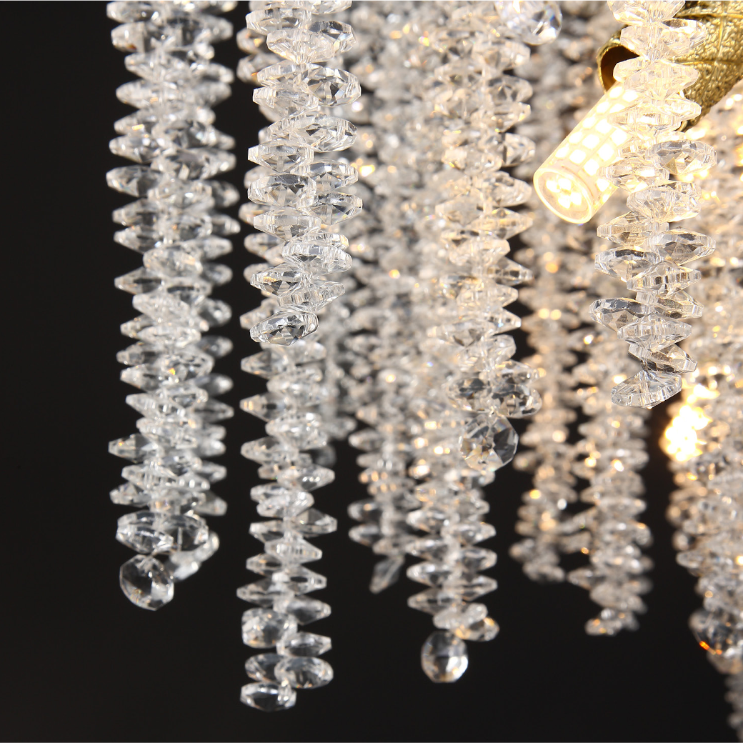The Wisteria Rectangular Chandelier illuminating a luxury dining room, casting a soft, luminous glow over a high-end interior setting.