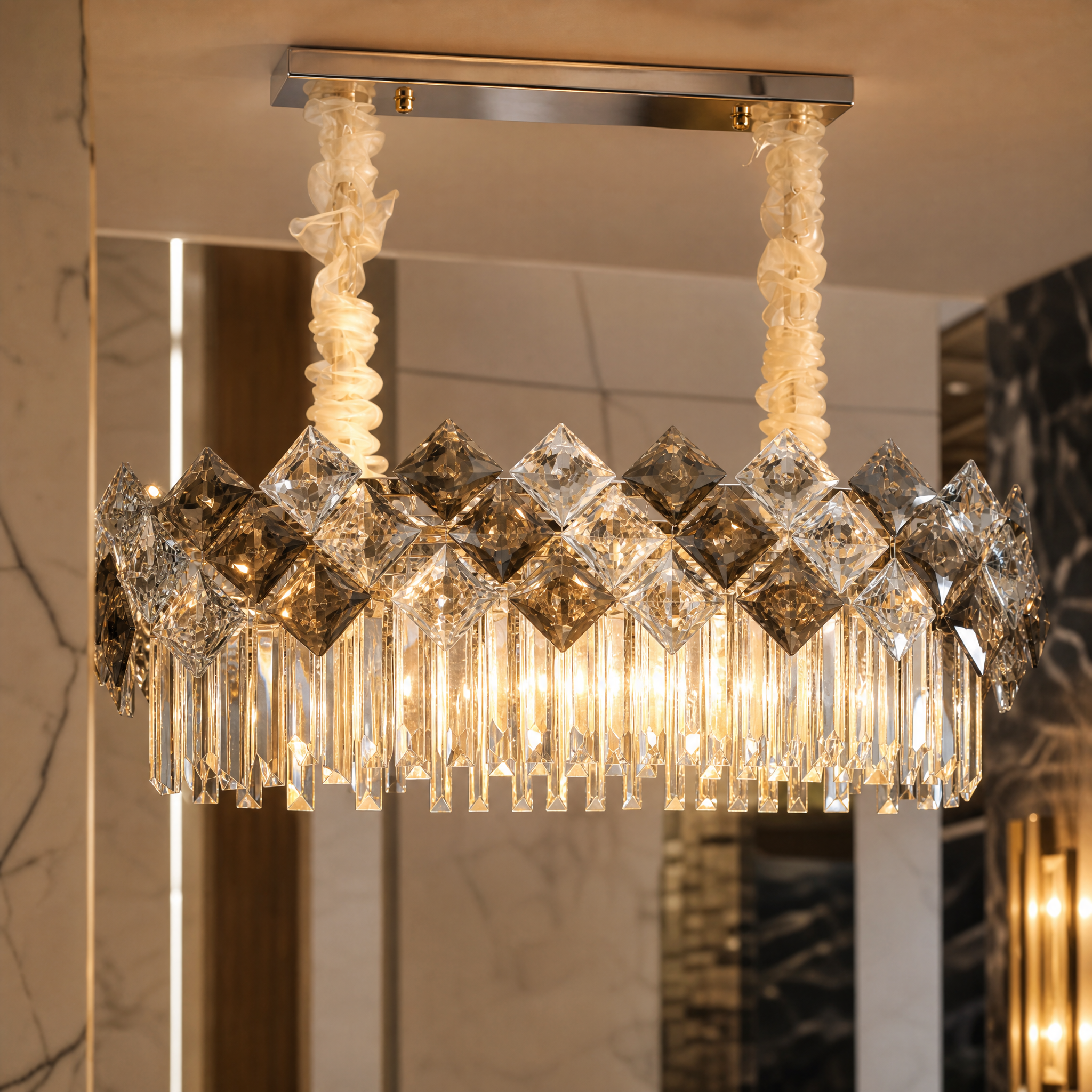 Close-up detail of the diamond-cut clear and smoky grey crystals on the VORELLI Thirlmere Rectangular Chandelier II.