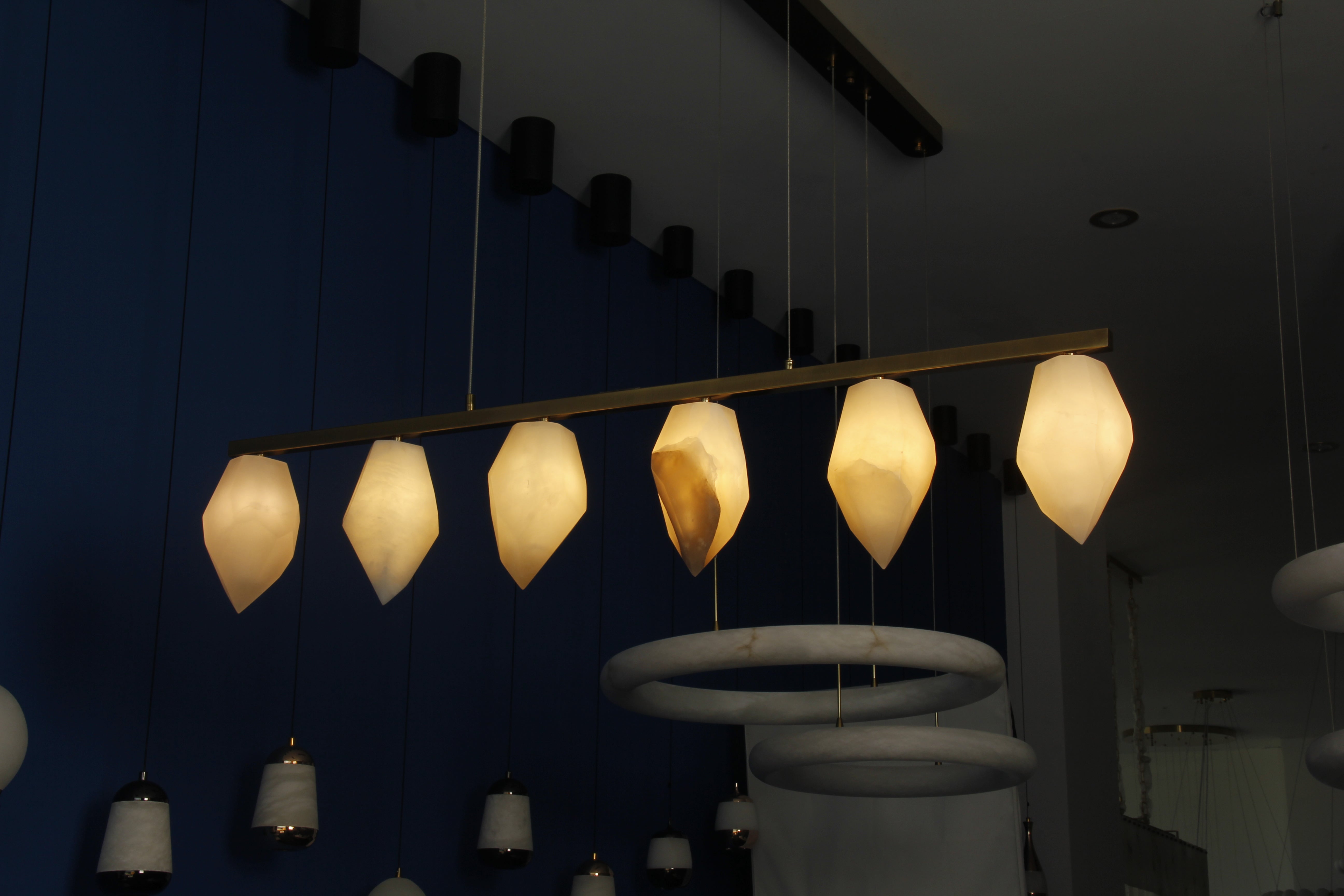 Modern Tuscana marble linear chandelier with sculptural hanging marble pendants